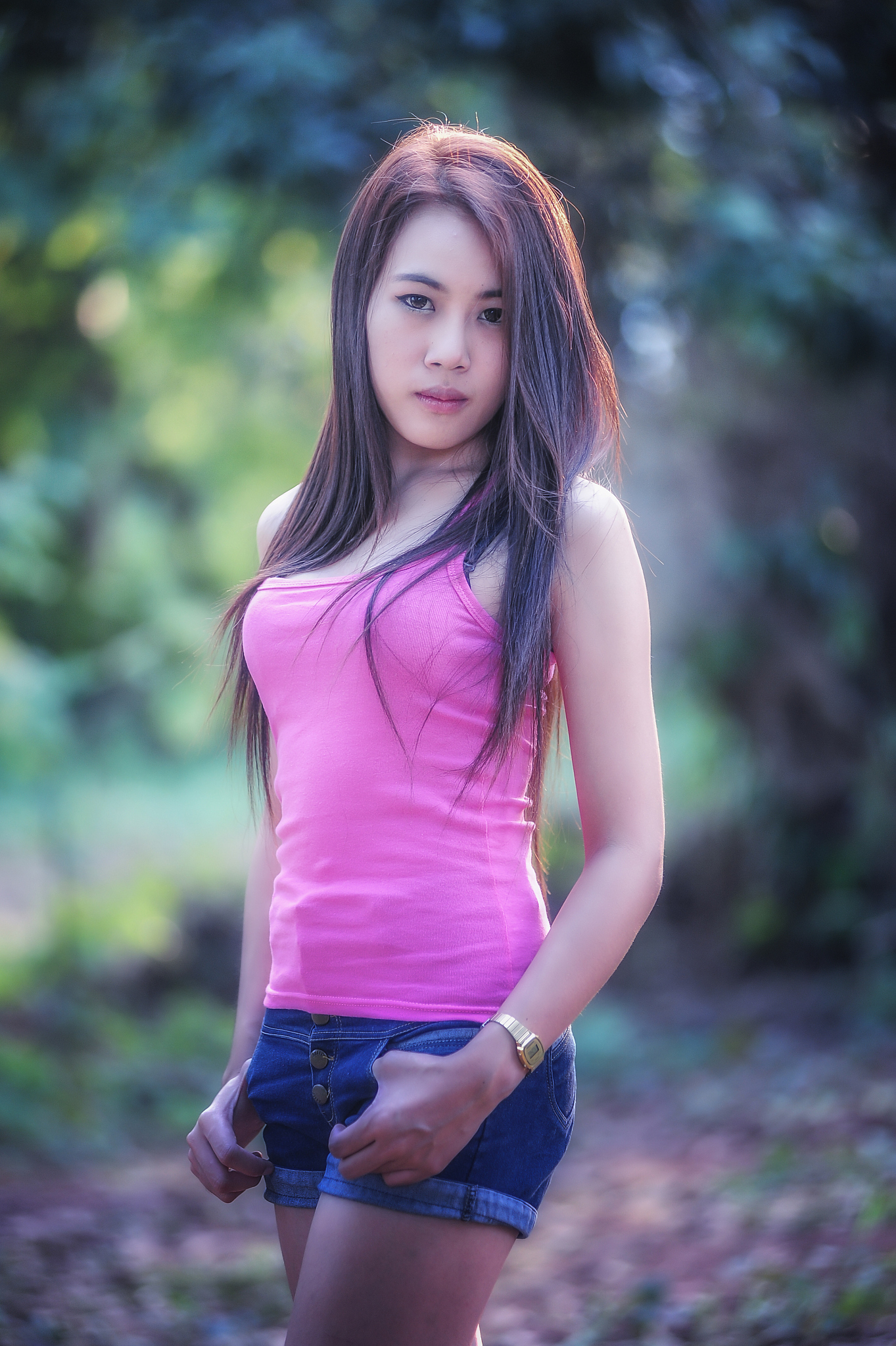asia young woman wearing pink vest  and short jeans