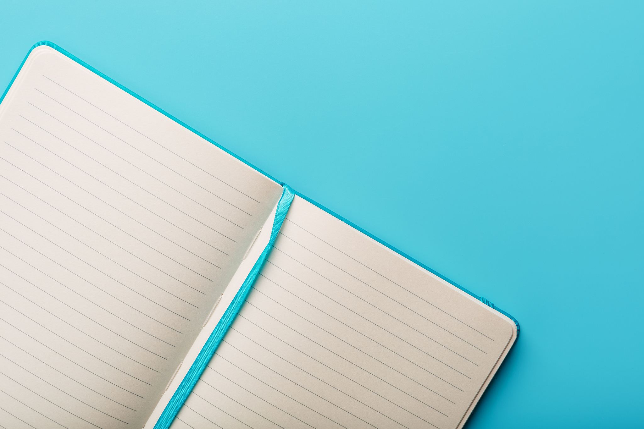 open notebook, a book with blank and blank pages on a blue backg