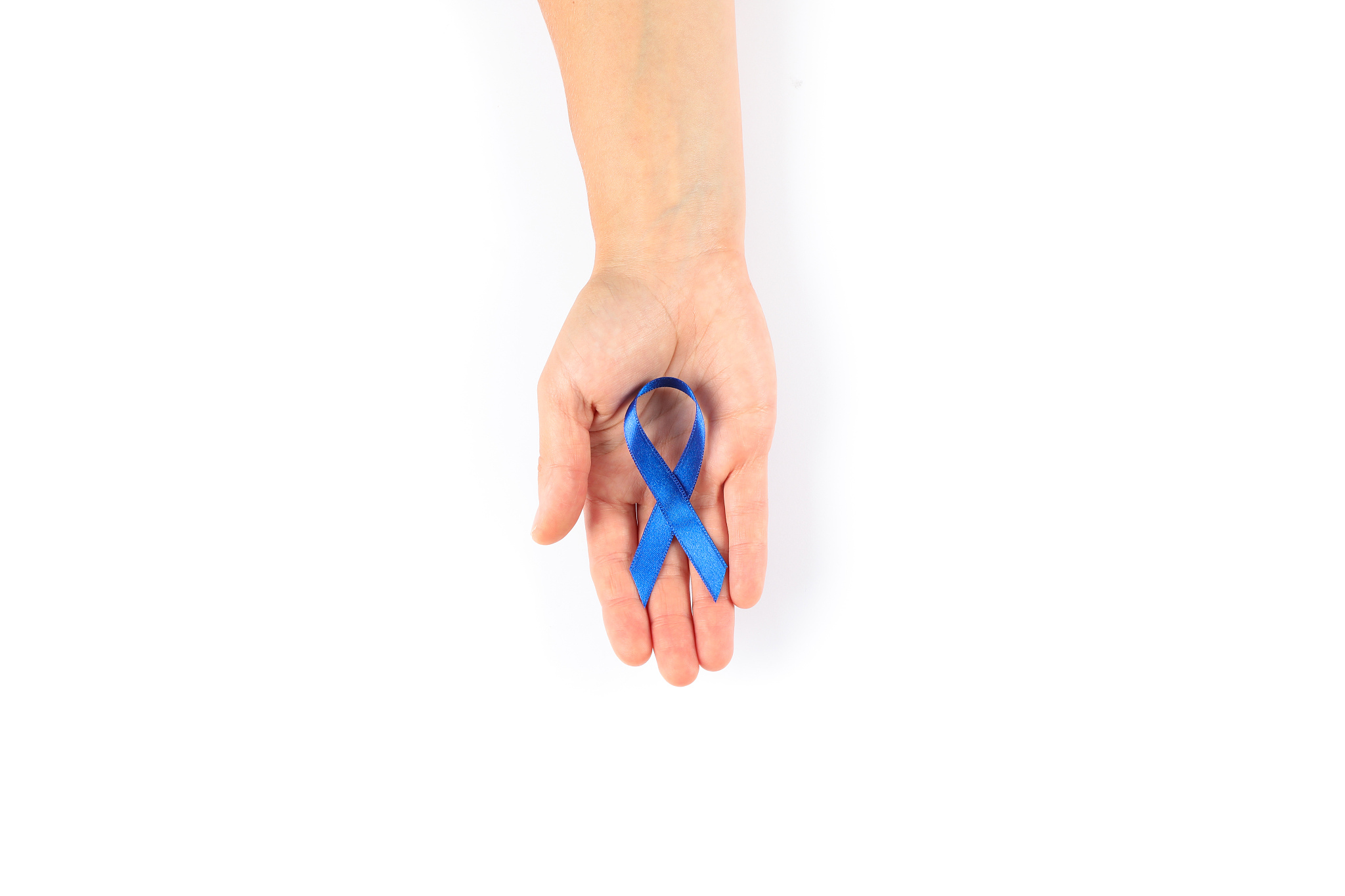 female hand with blue awareness ribbon isolated on white backgro