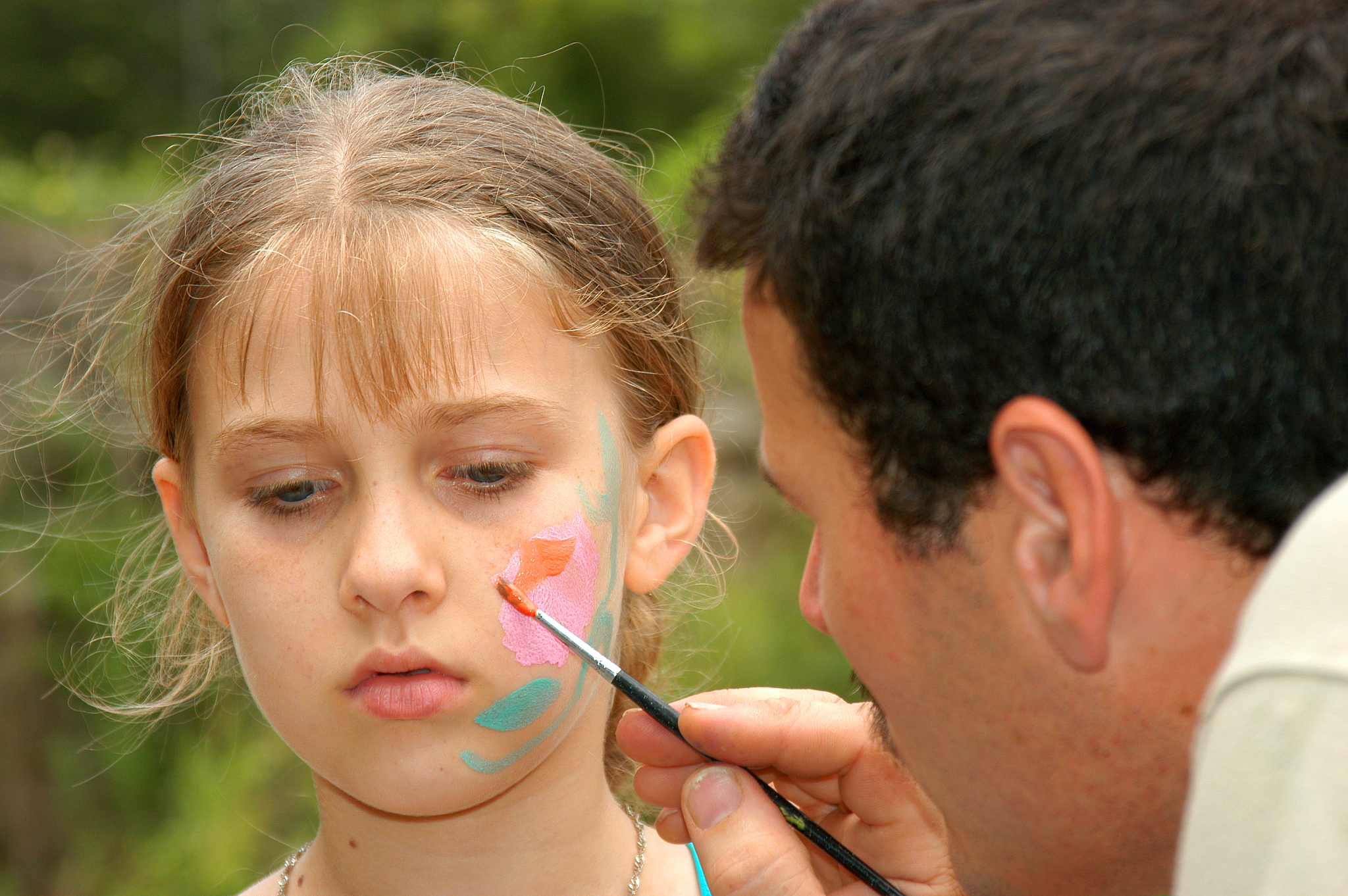 young girl has her face painted
