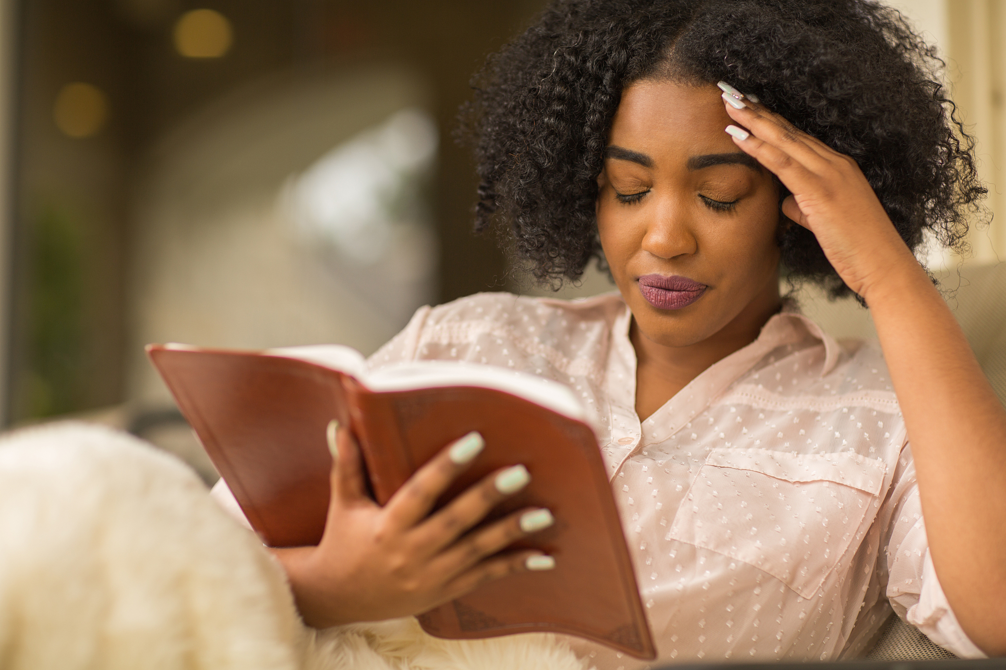 african american woman reading and upset.