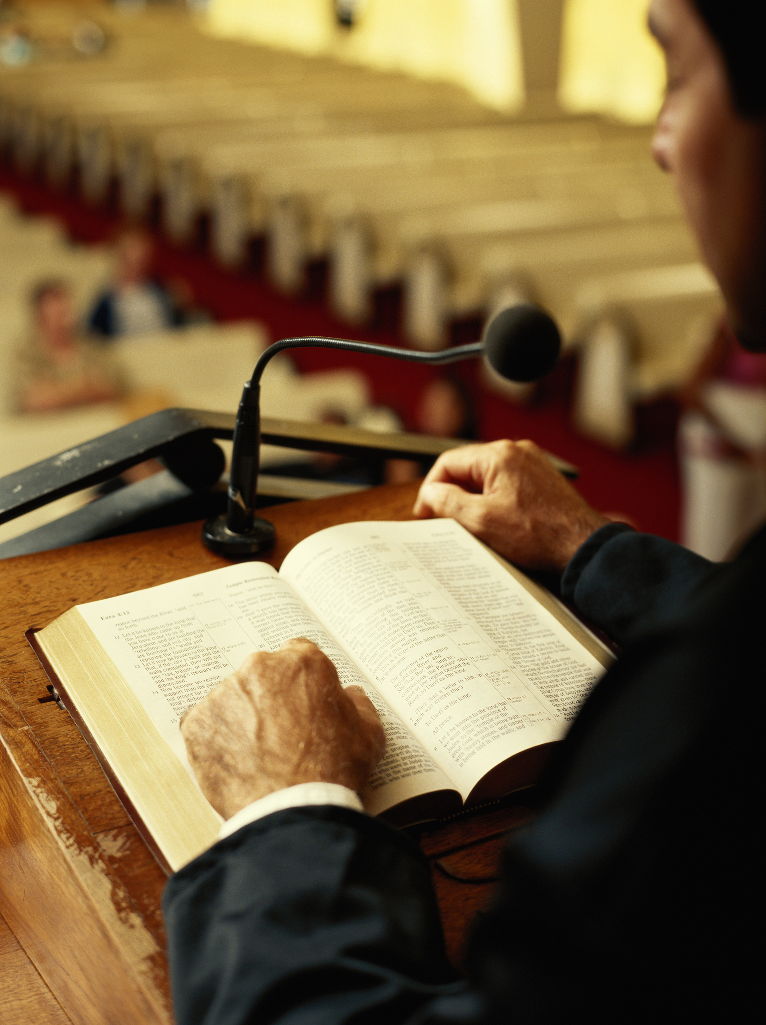 priest giving sermon in church