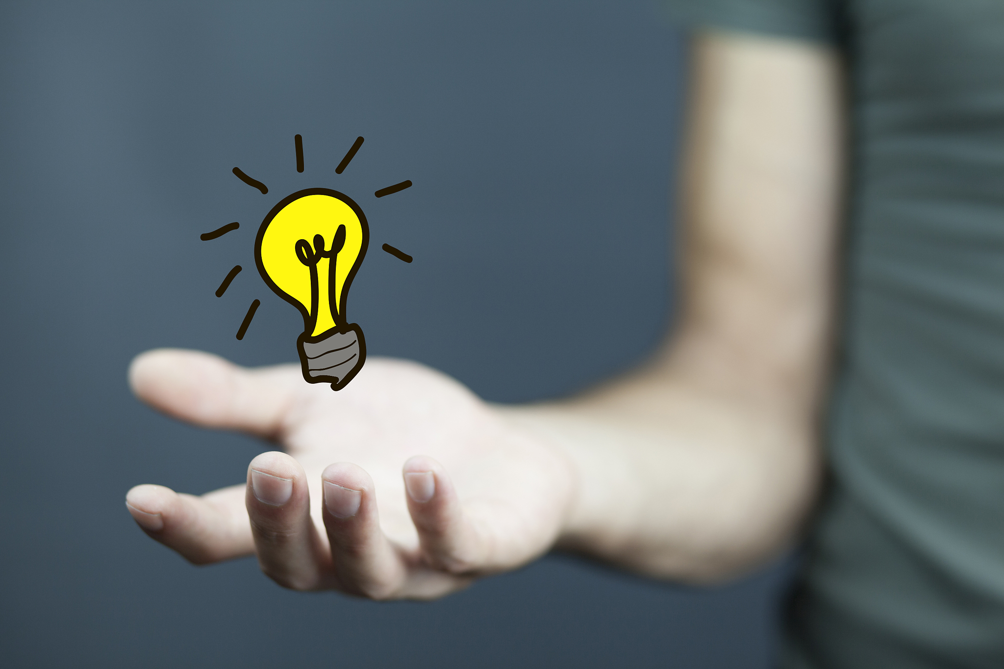 light bulb in hand businessman