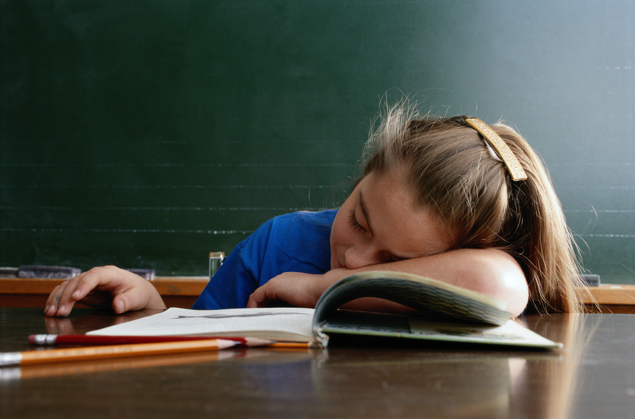 girl asleep at desk