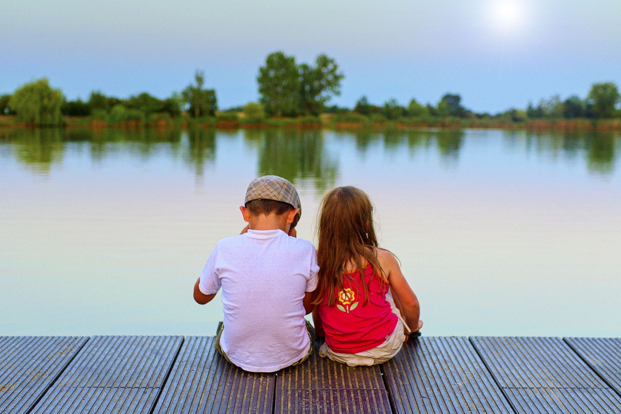 love, friendship and childhood concept. beautiful romantic sunse