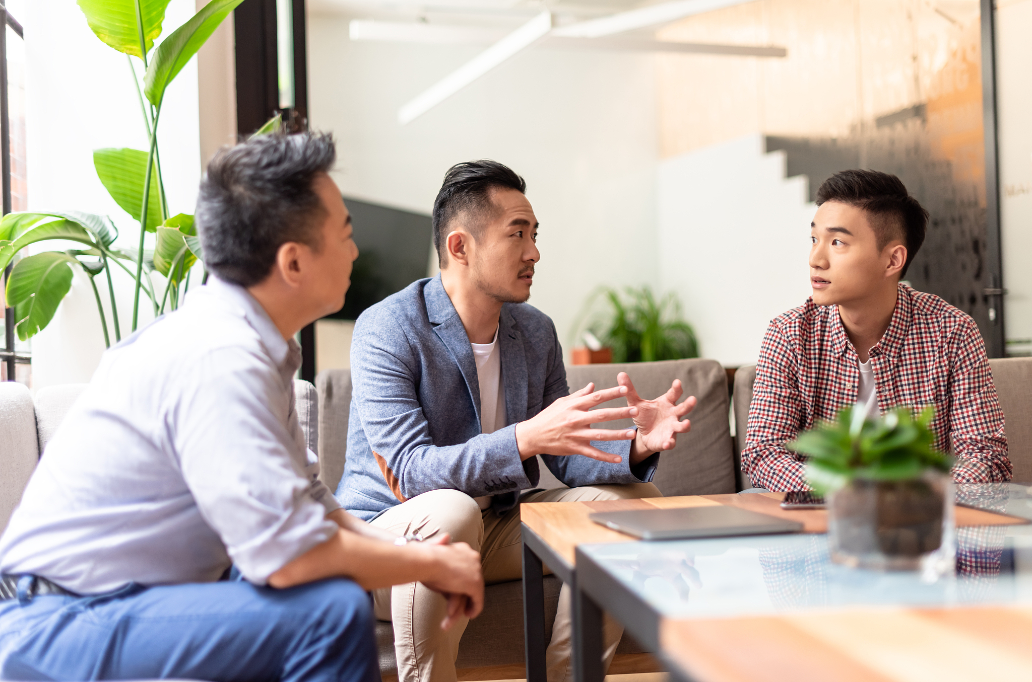 asian businessmen are discussing problem