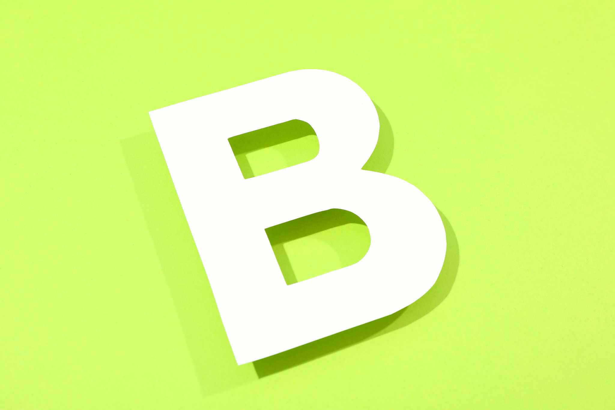 white letter b on color background, space for textwhite letter b