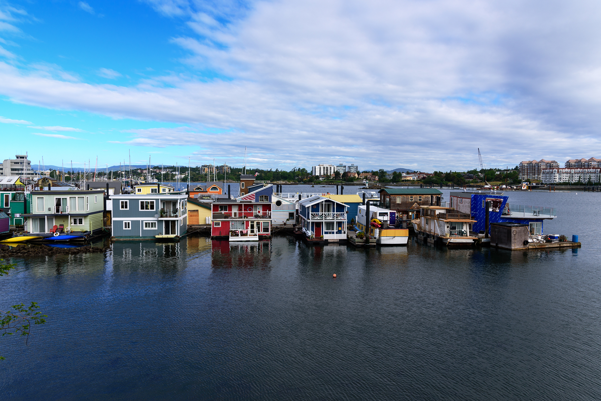 view of floating home village blue, red, orange, yellow houseboa