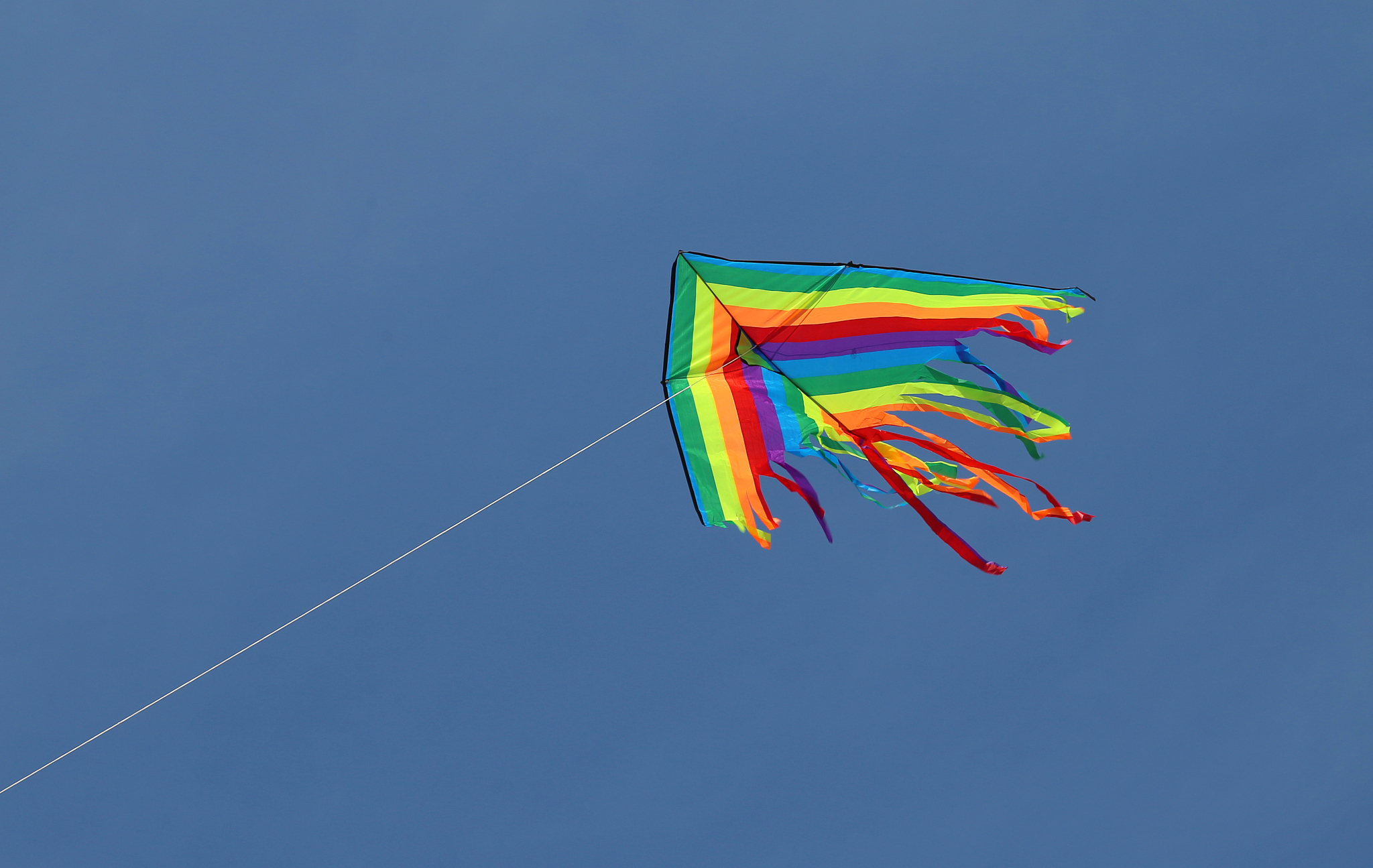 colored kite flying high in the sky symbol of freedom and carefr