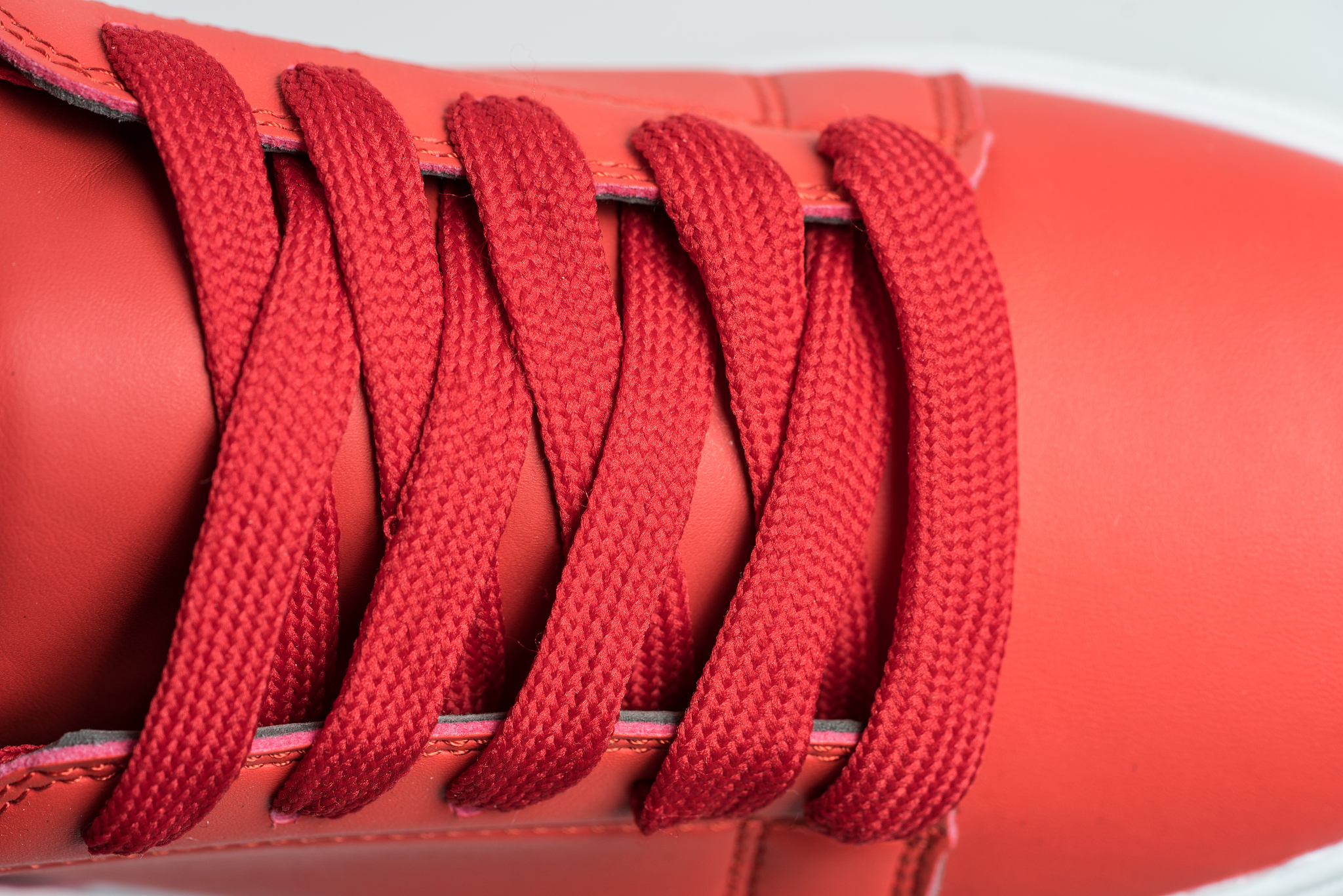 fashion shoes with shoestring. red sneaker and shoelace isolated
