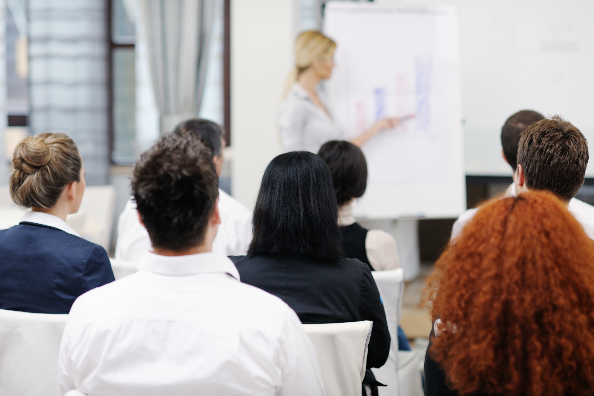 business people group at meeting seminar presentation in brigt c