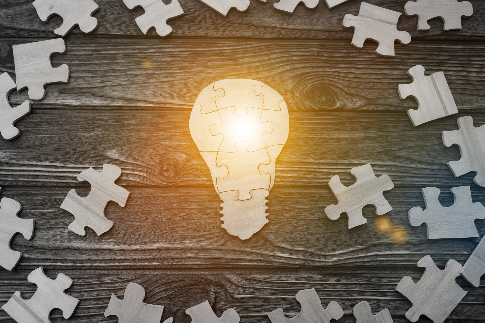 lamp idea assembled from puzzles. business concept, thought proc