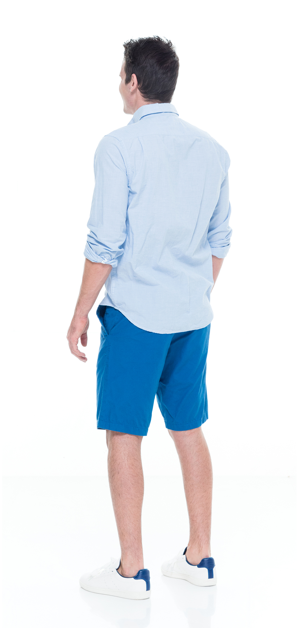 caucasian young male standing wearing rolled-up sleeves