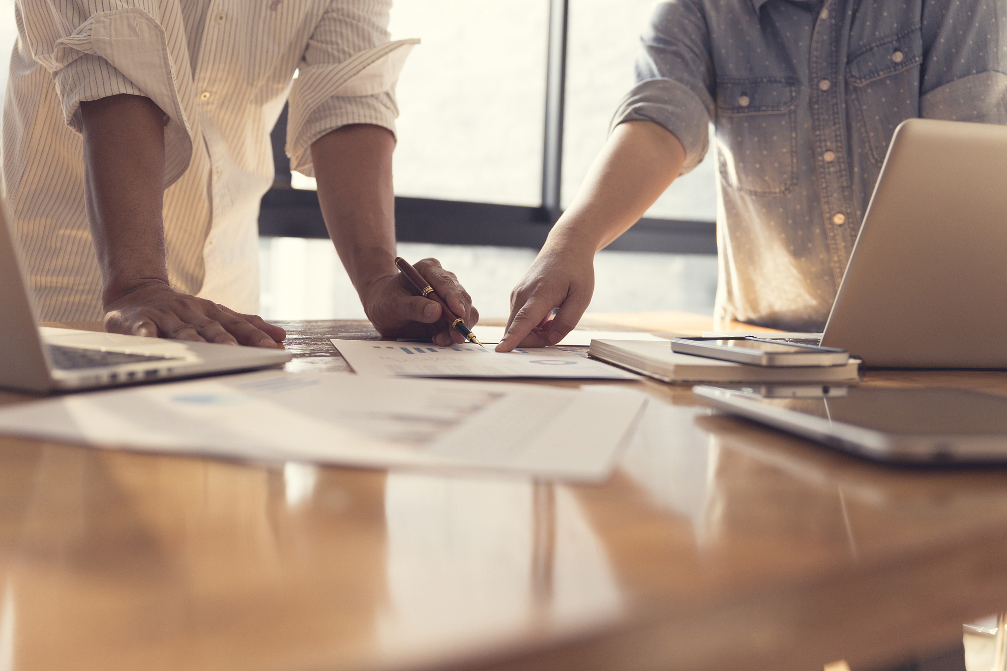 people working with document together