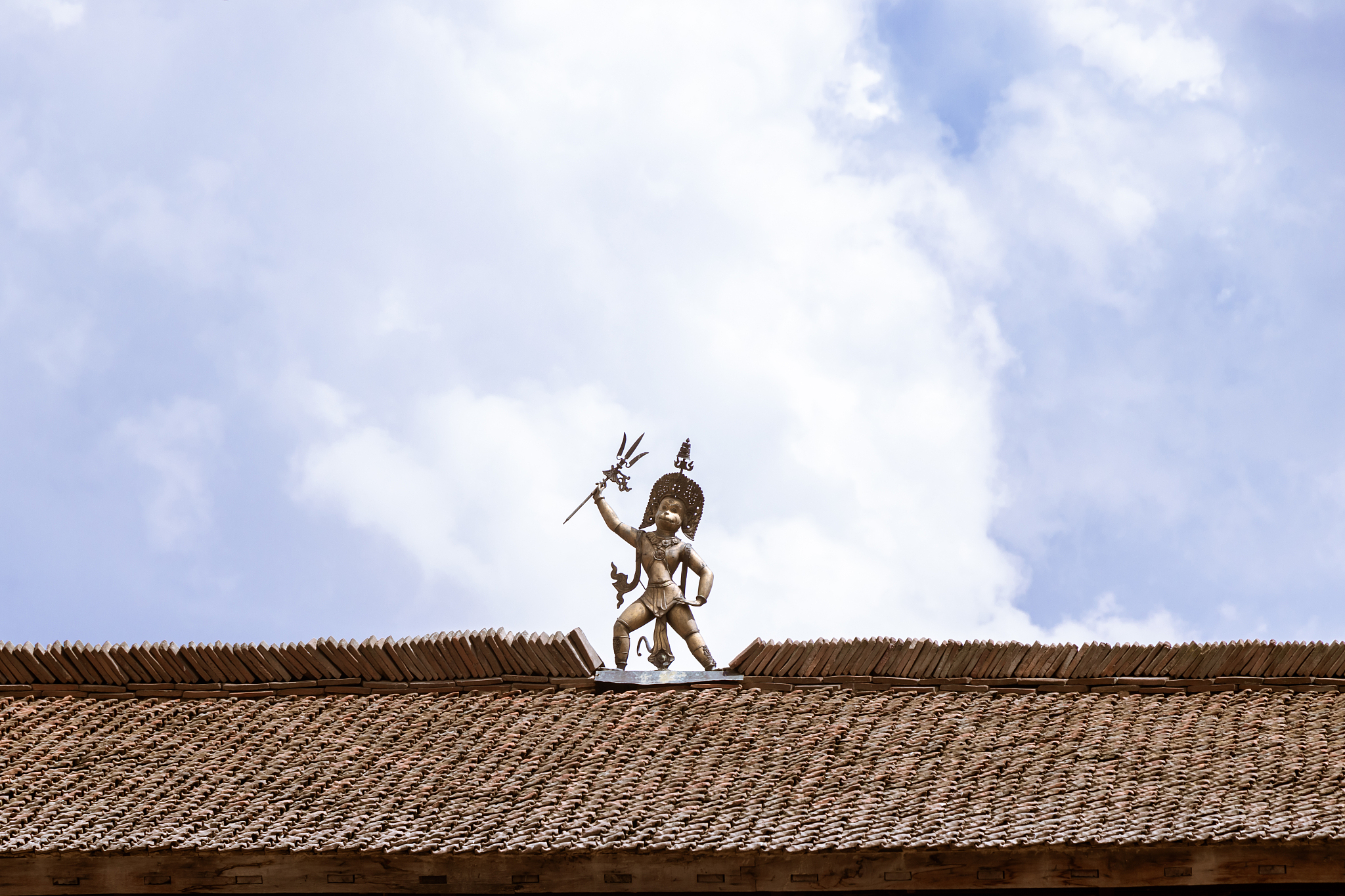 statue at the roof-top of the patan durbar square, patan