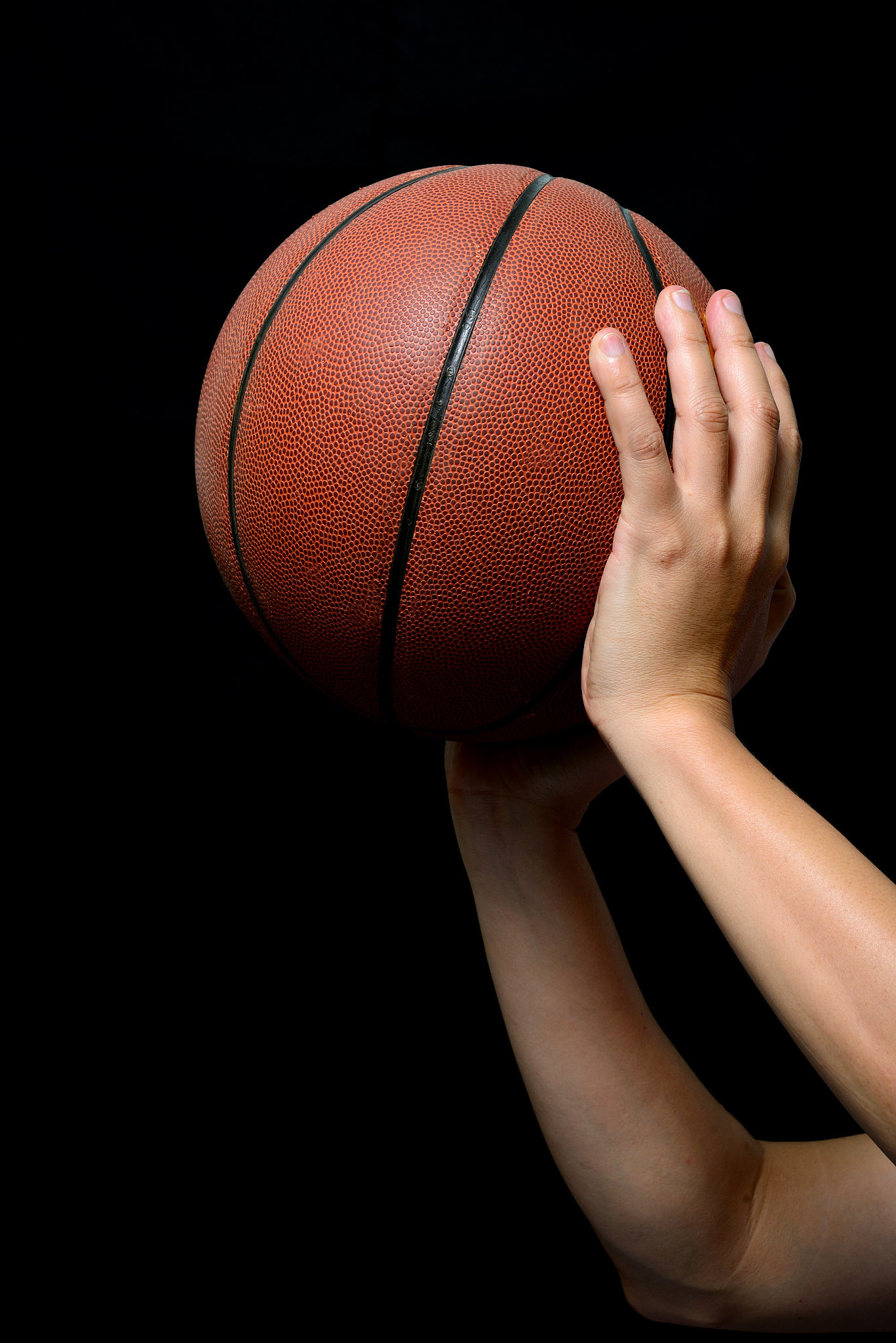 basketball ball in male hands