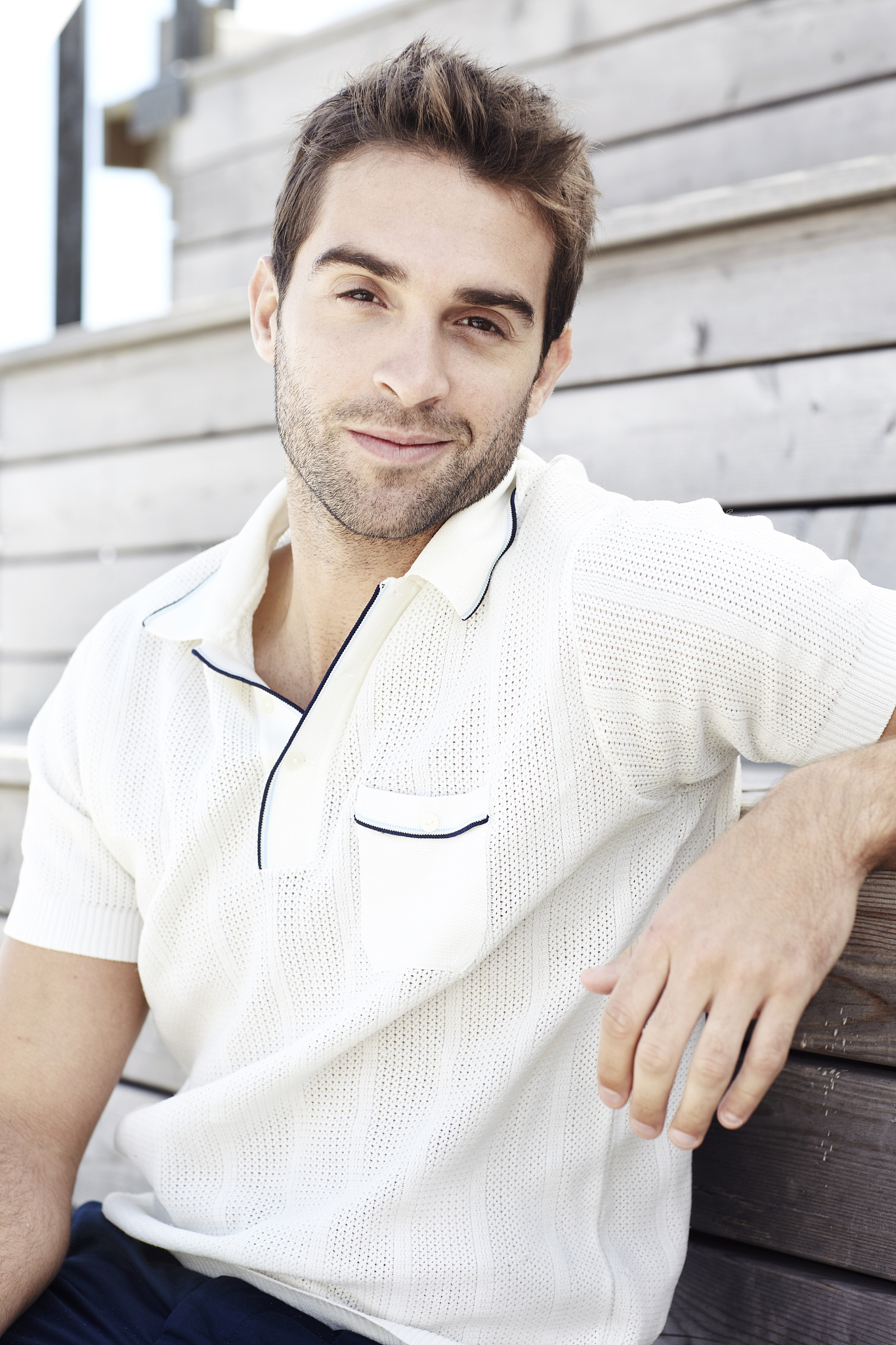 portrait of mid adult man in polo shirt, smiling