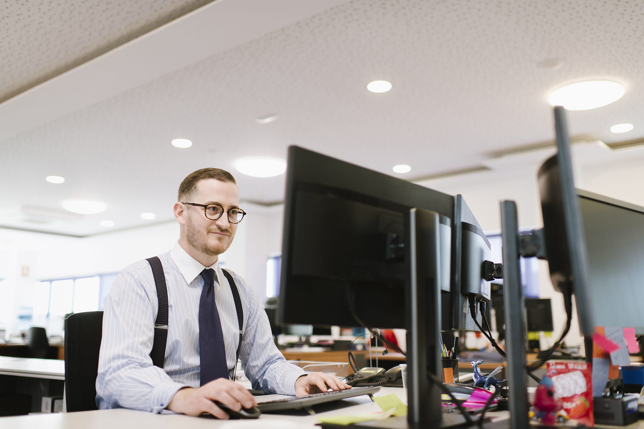 businessman using computer at desk in office