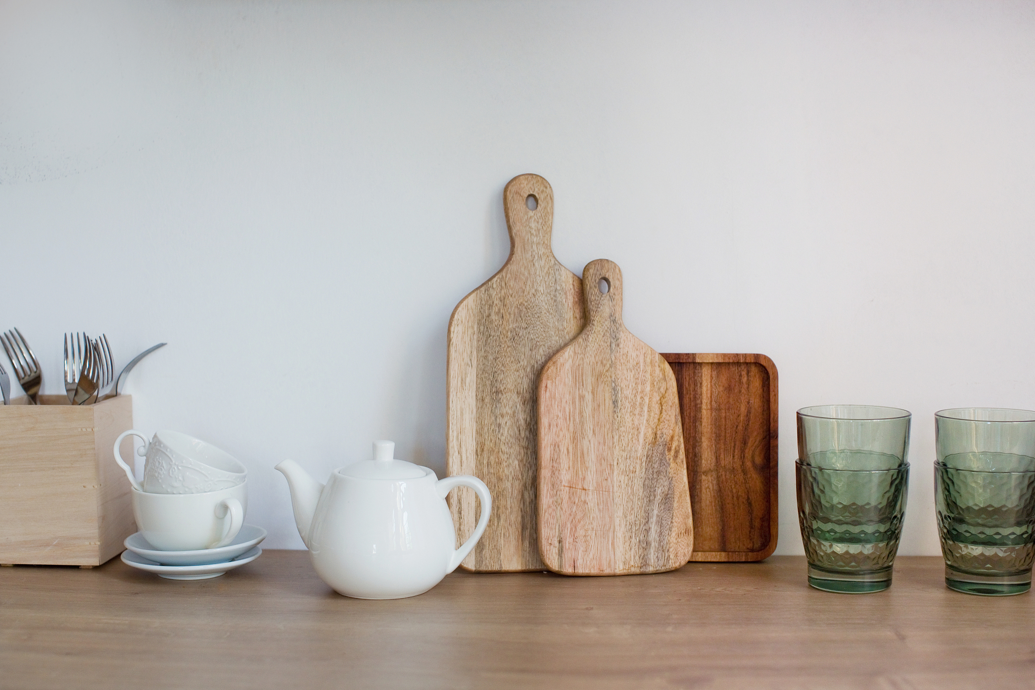 kitchen utensils on light wooden kitchen