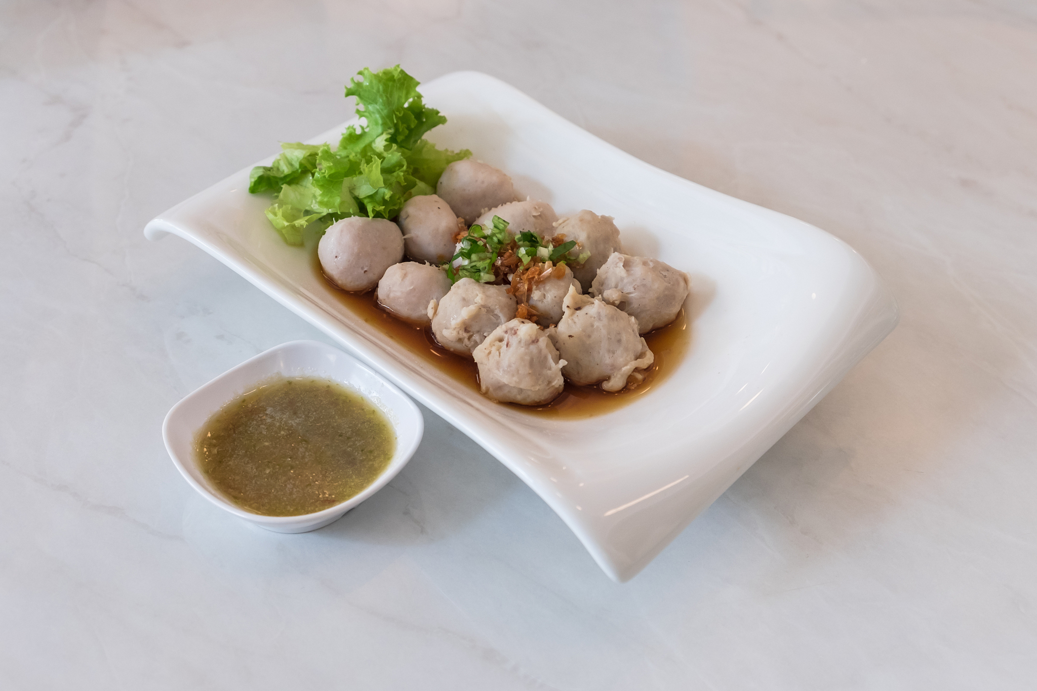 pork balls with spicy dipping in thai restaurant