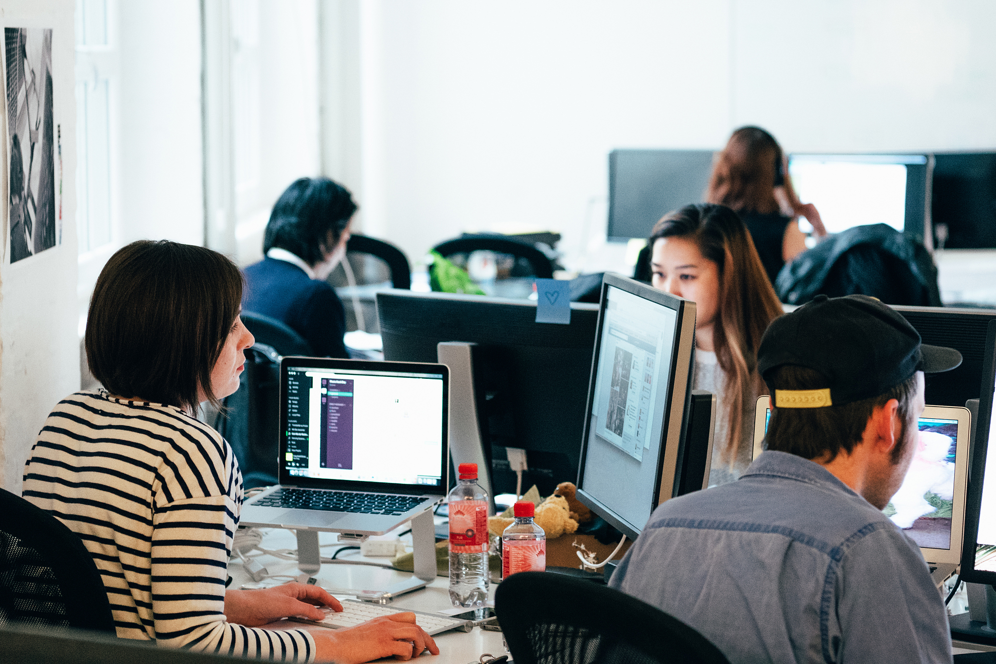 people working on computers in office