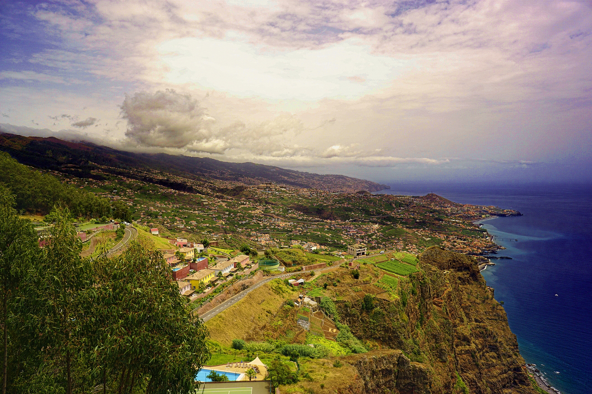 high angle view of land and sea against sky