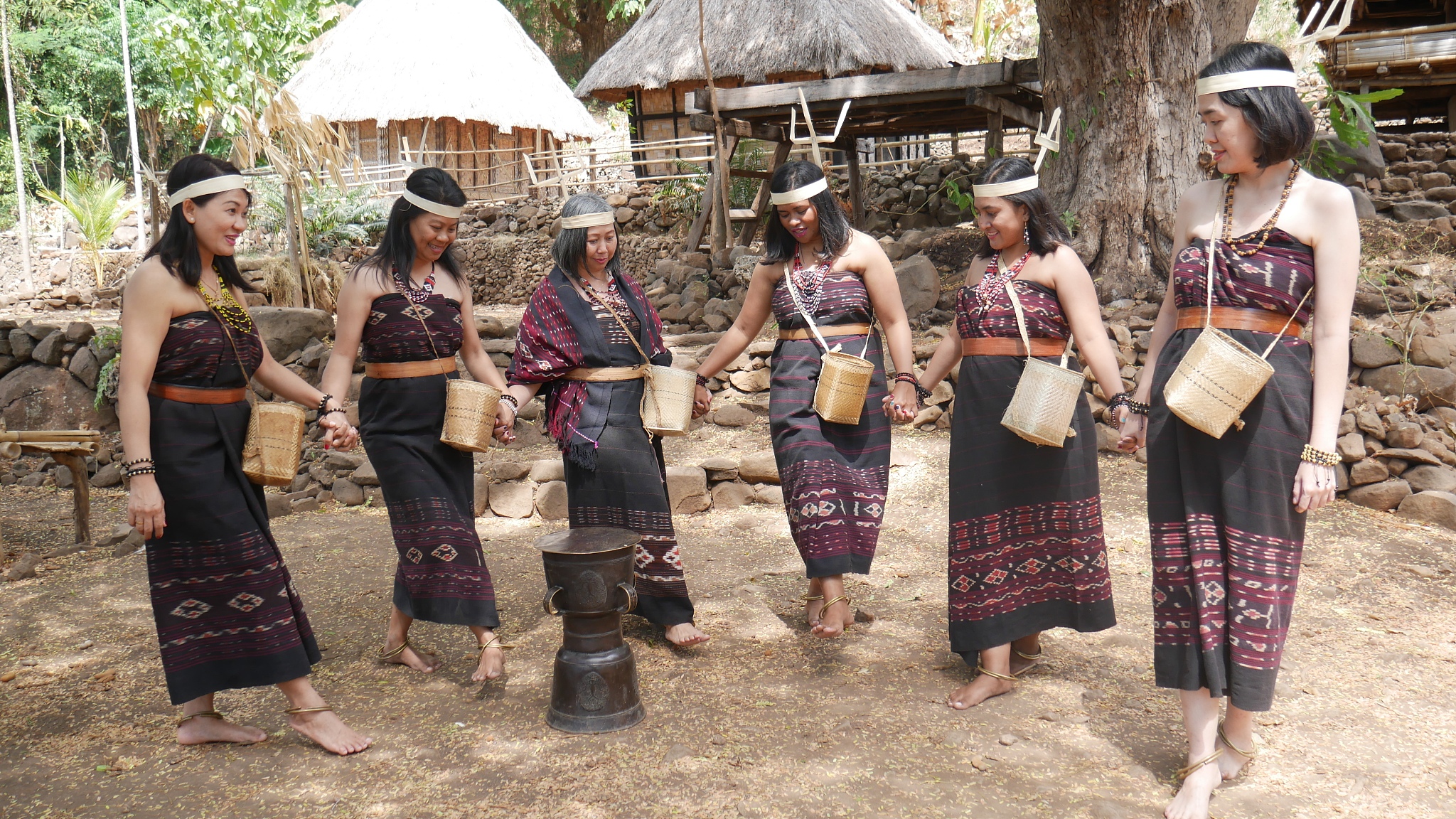 group of women in traditional clothes dancing during festival