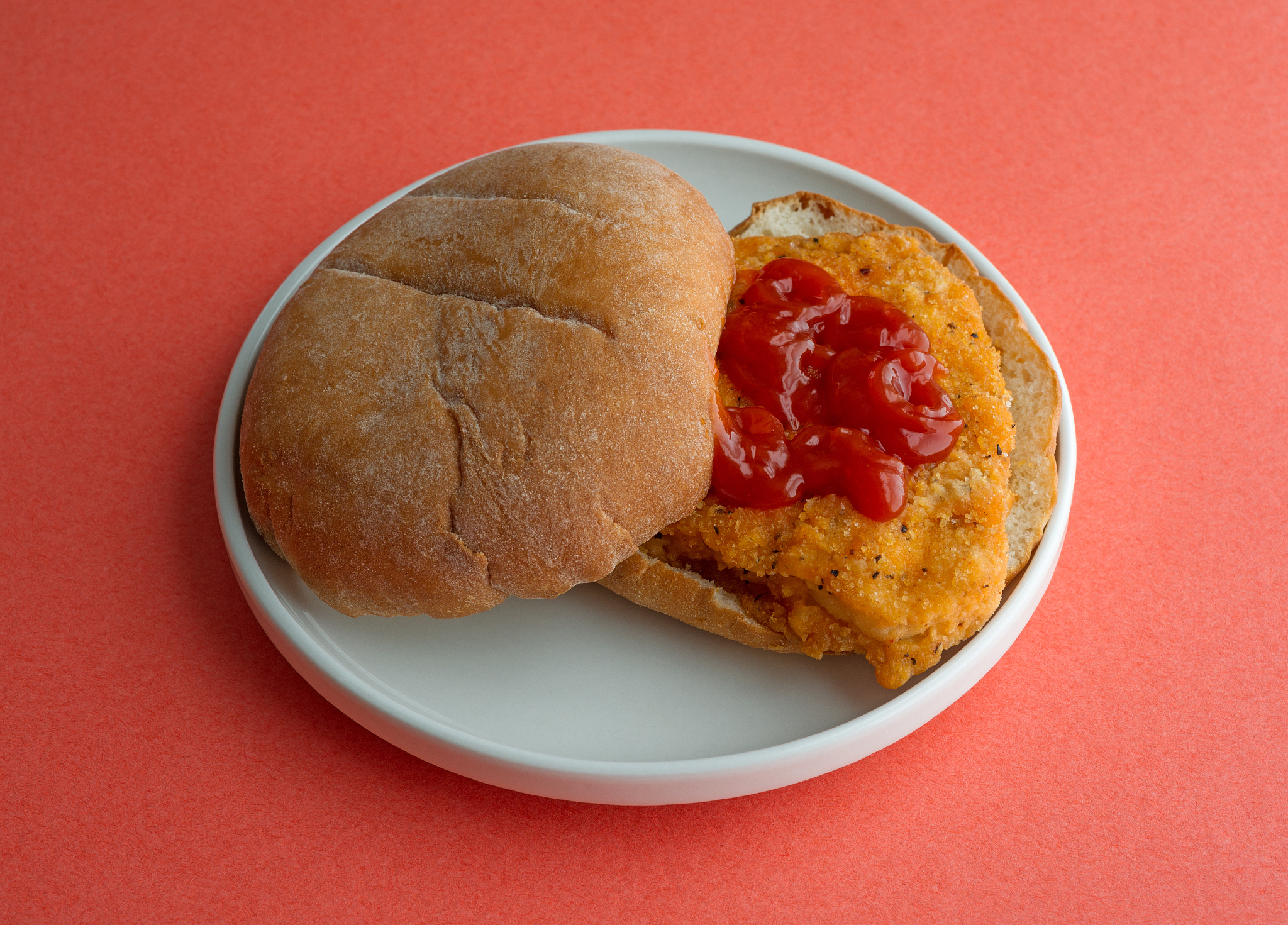 breaded chicken sandwich with ketchup