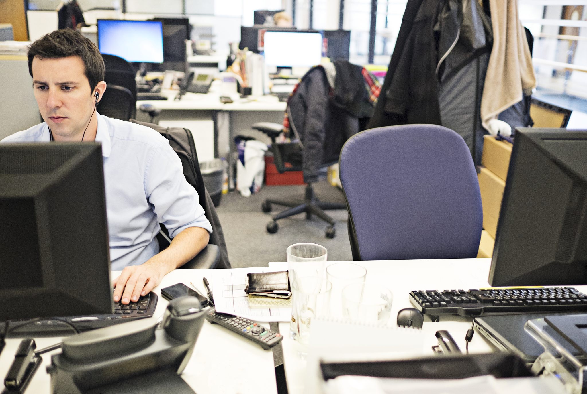 man working on computer in office