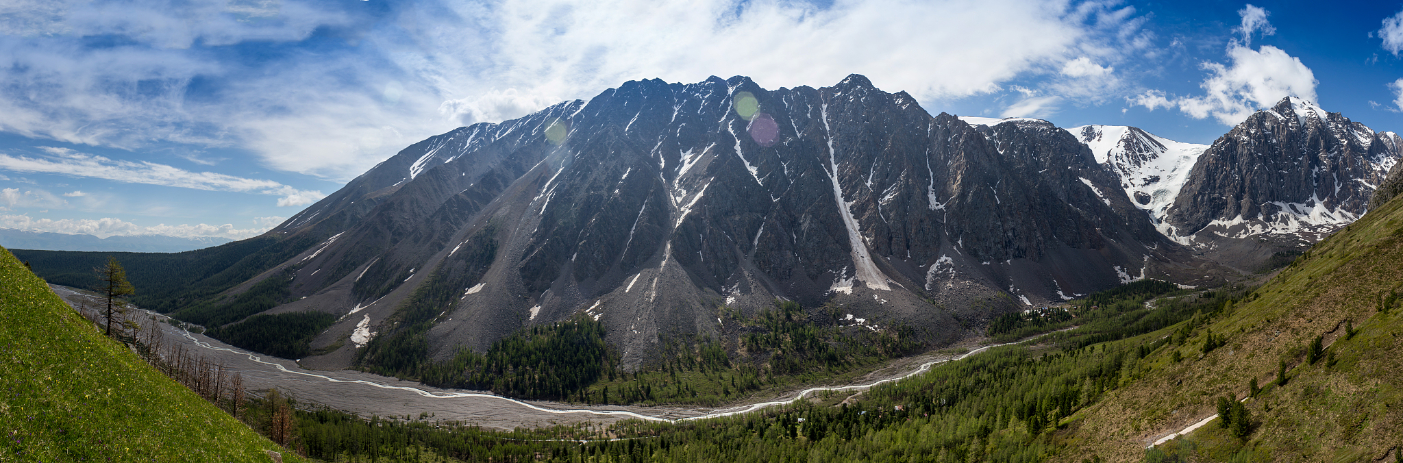 panorama of mountains, arid wild landscape and blue sky