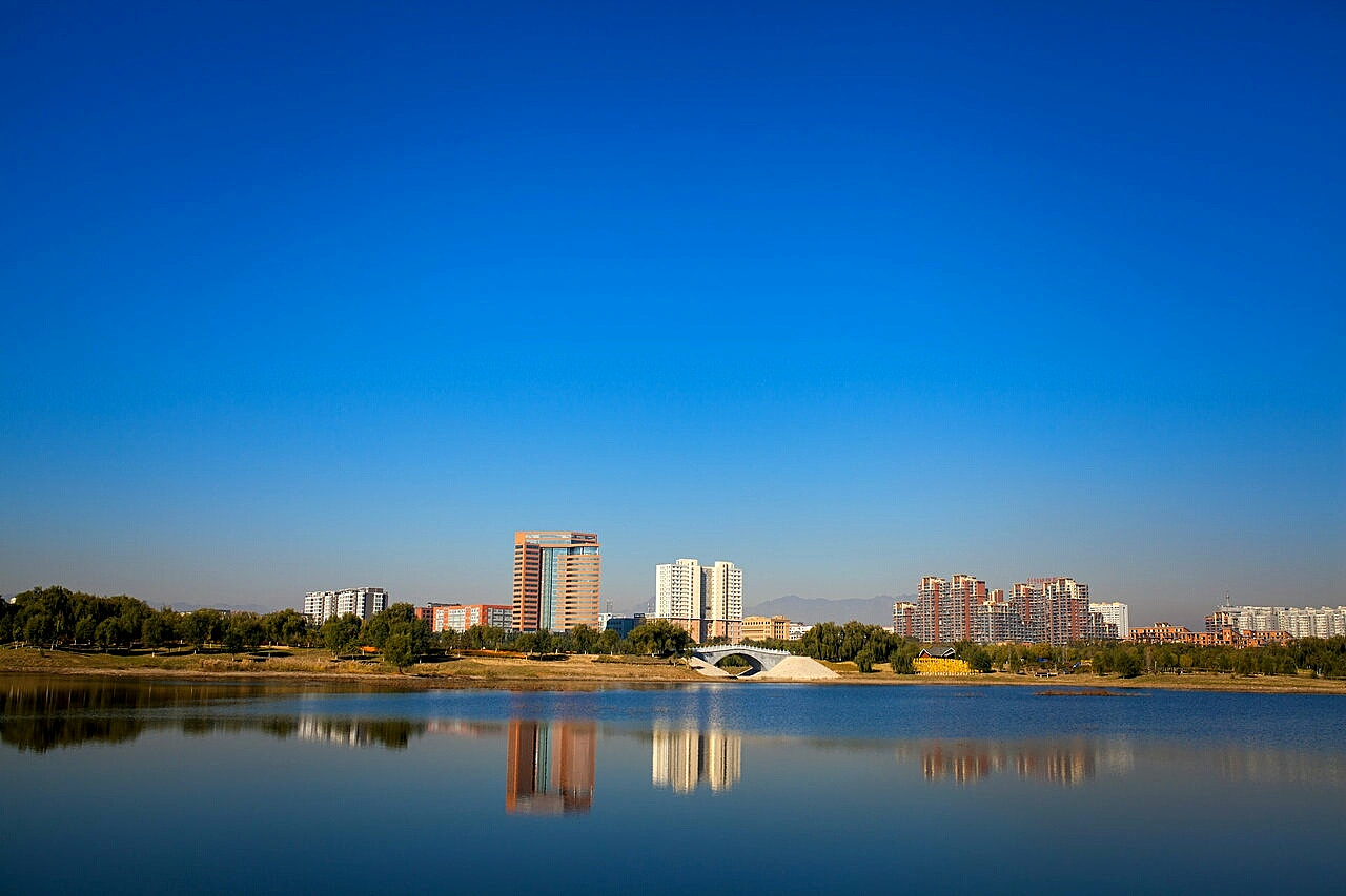 buildings in city against clear sky