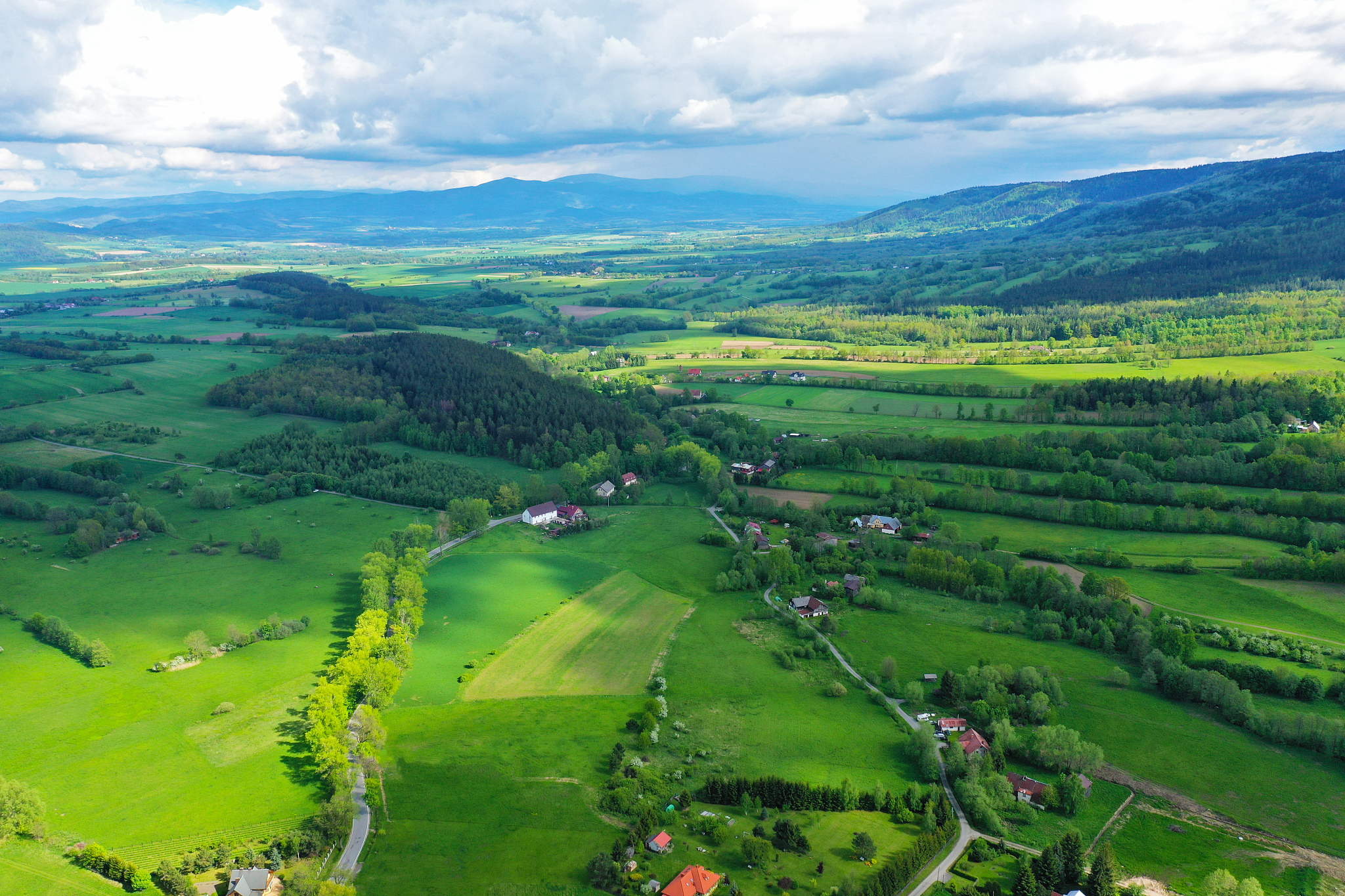 aerial perspective view on sudety mountains during cloudy day wi