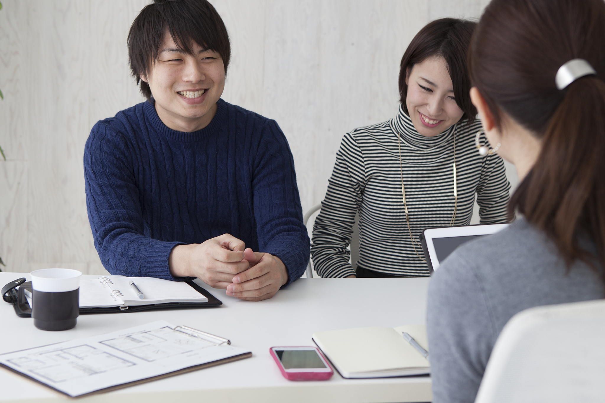 men talking about new house in a real estate agency