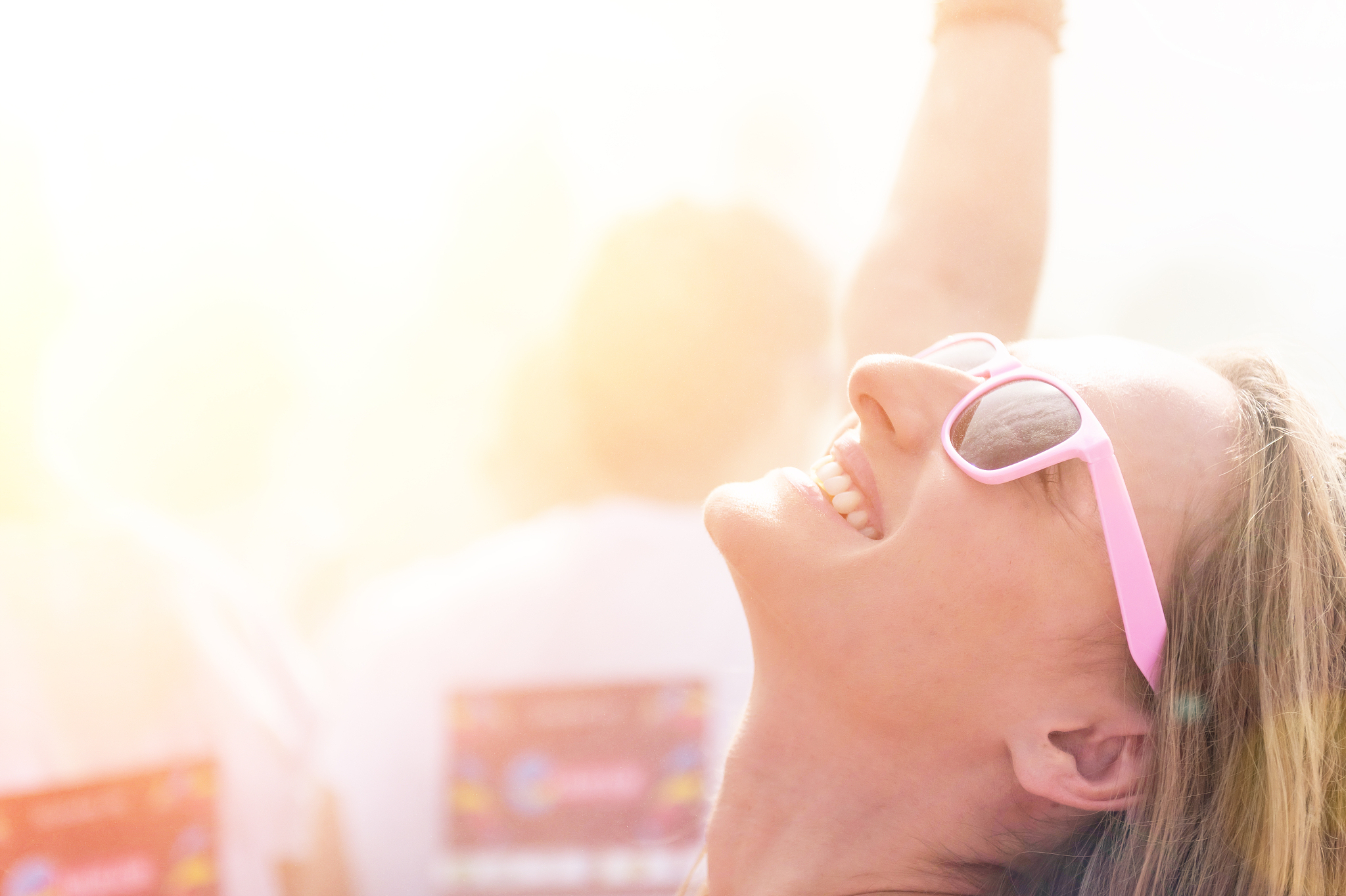 carefree woman dancing at summer fest