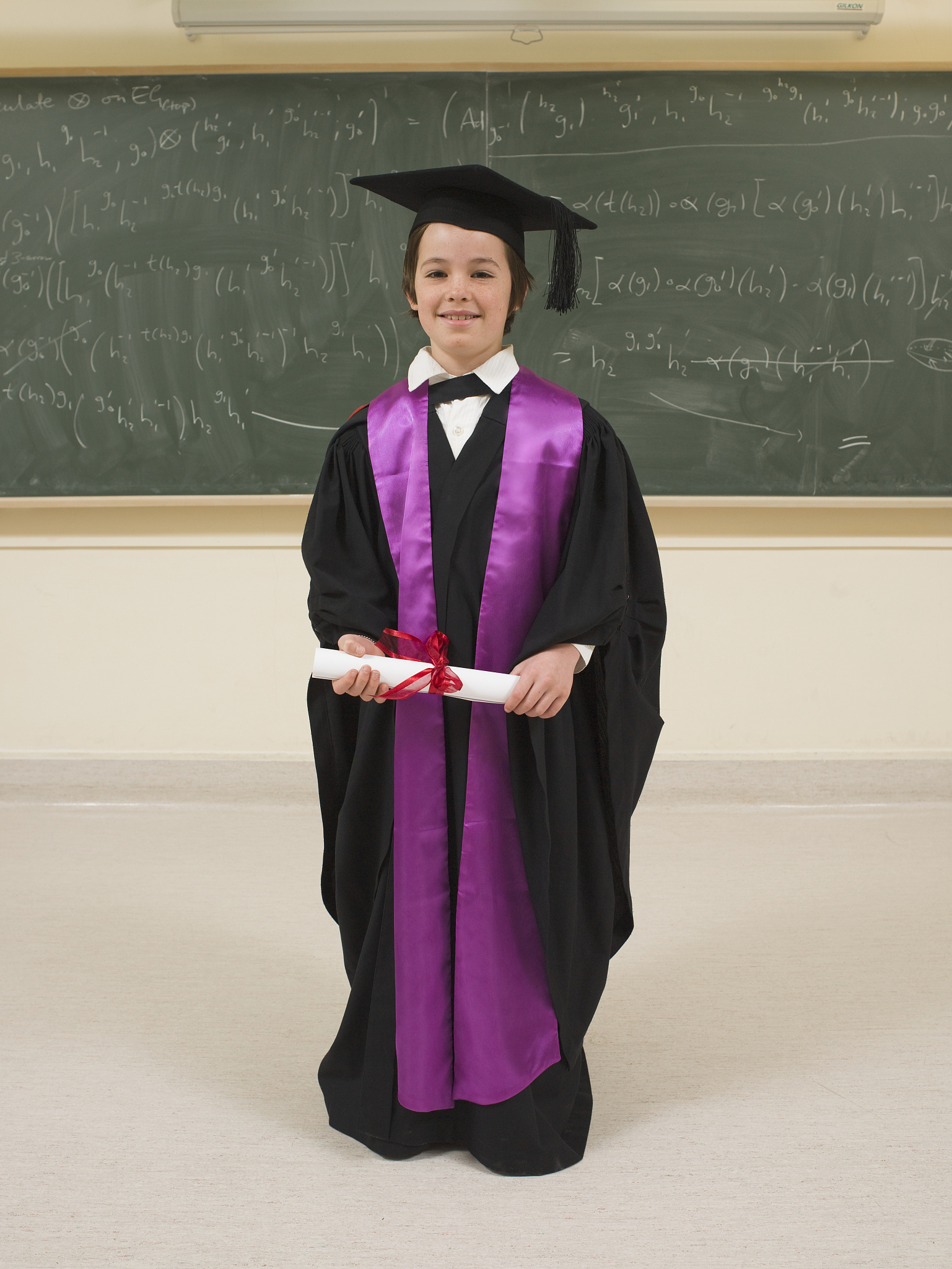 child prodigy with diploma