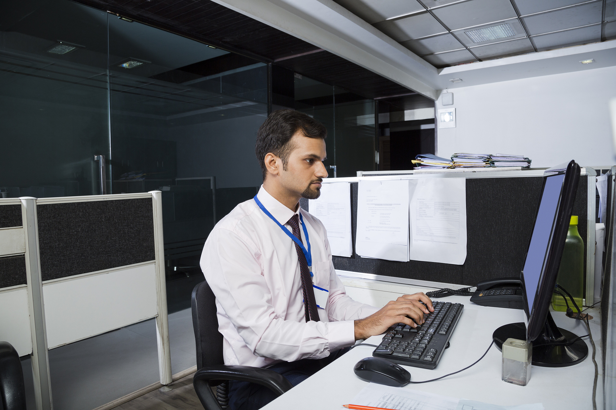 working late in a small office in barcelona - stock image
