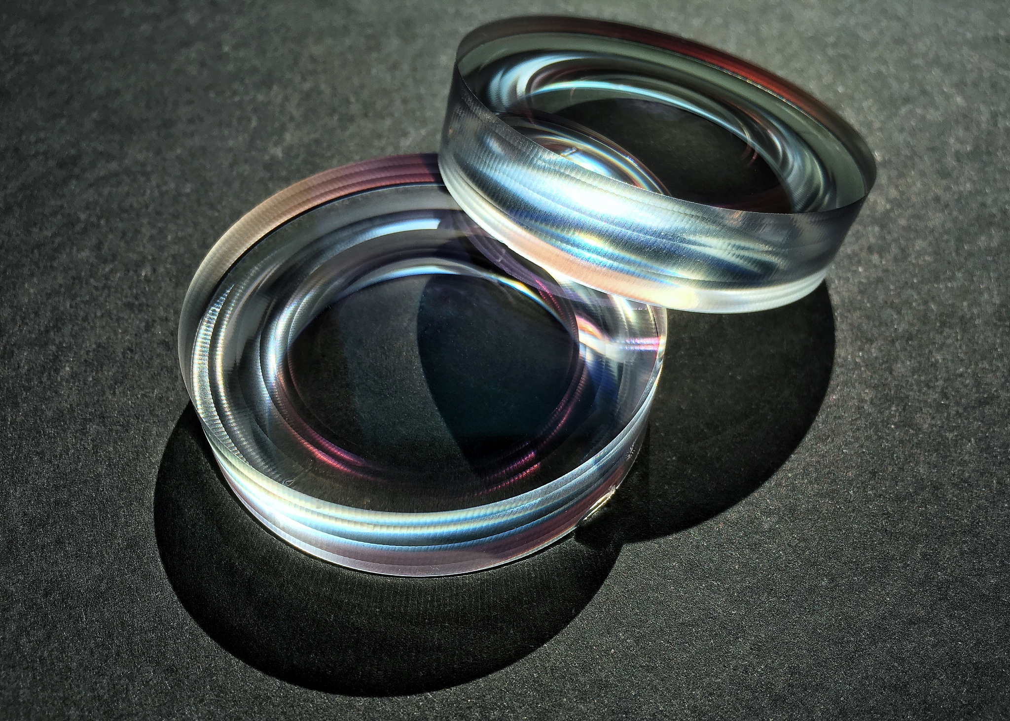 a pair of optic lenses on a black background.