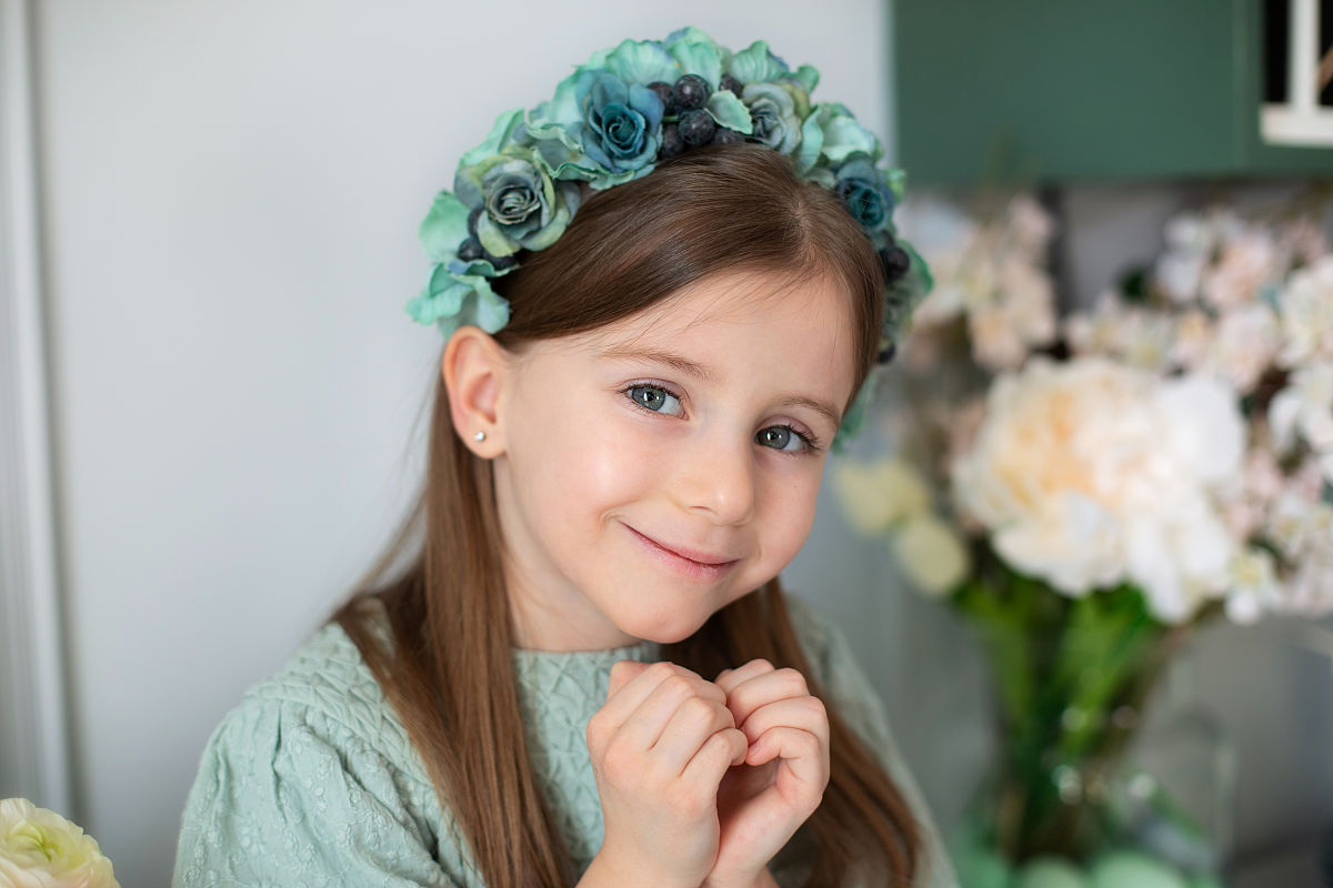 Little Girl with Flower Headscarf Laughs Joyfully