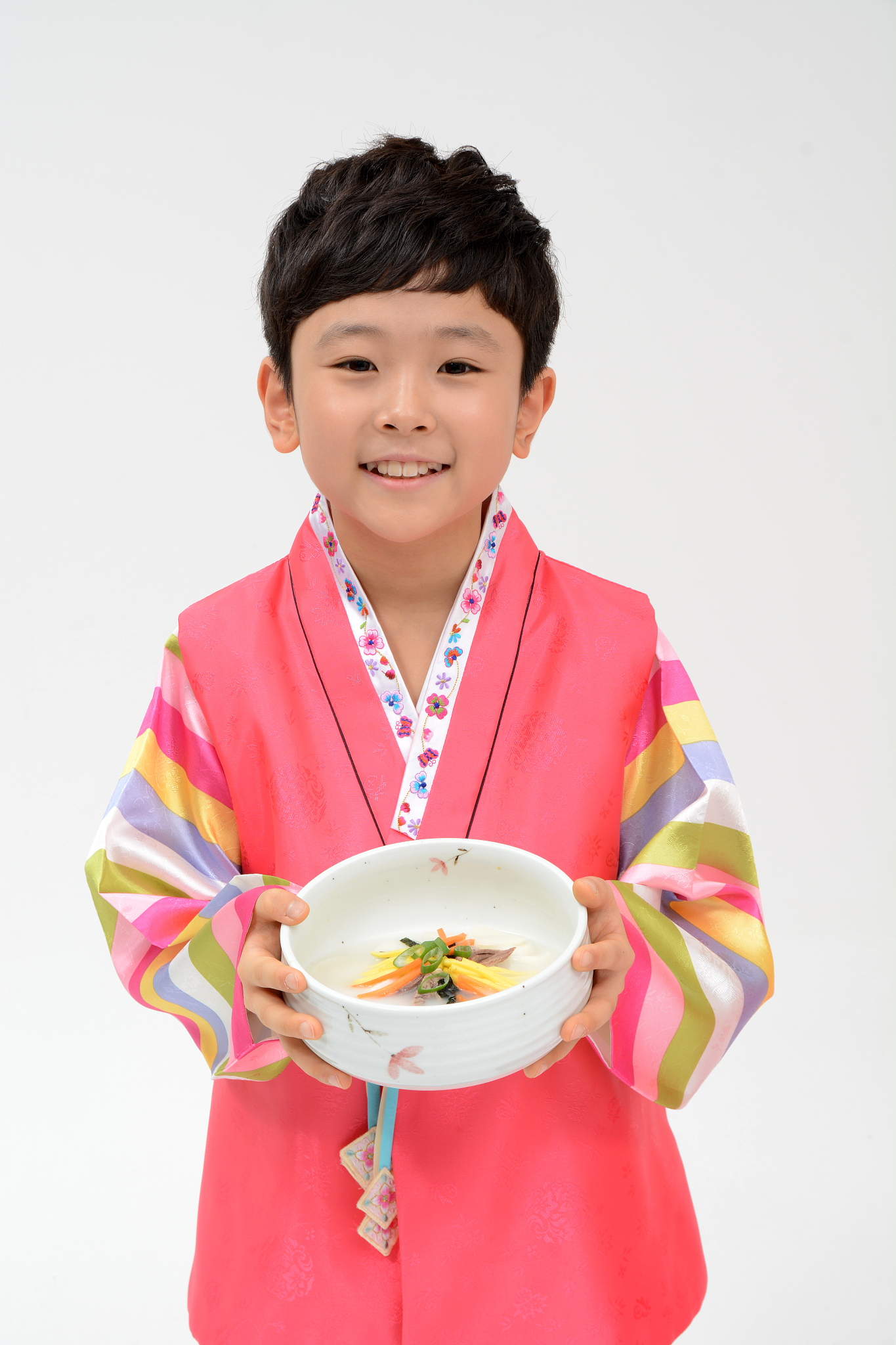a child with rice cake soup