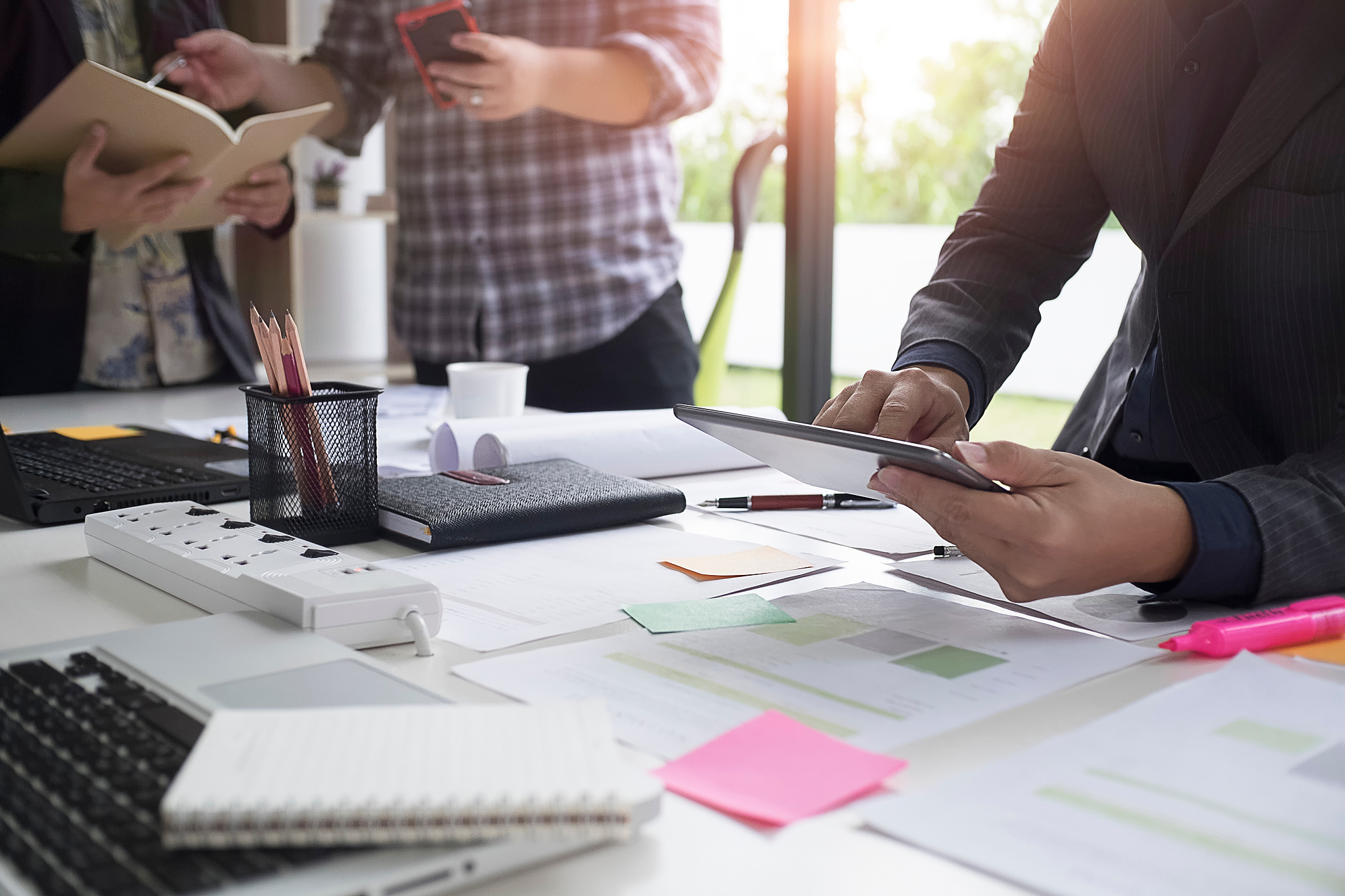 business people working by desk at office