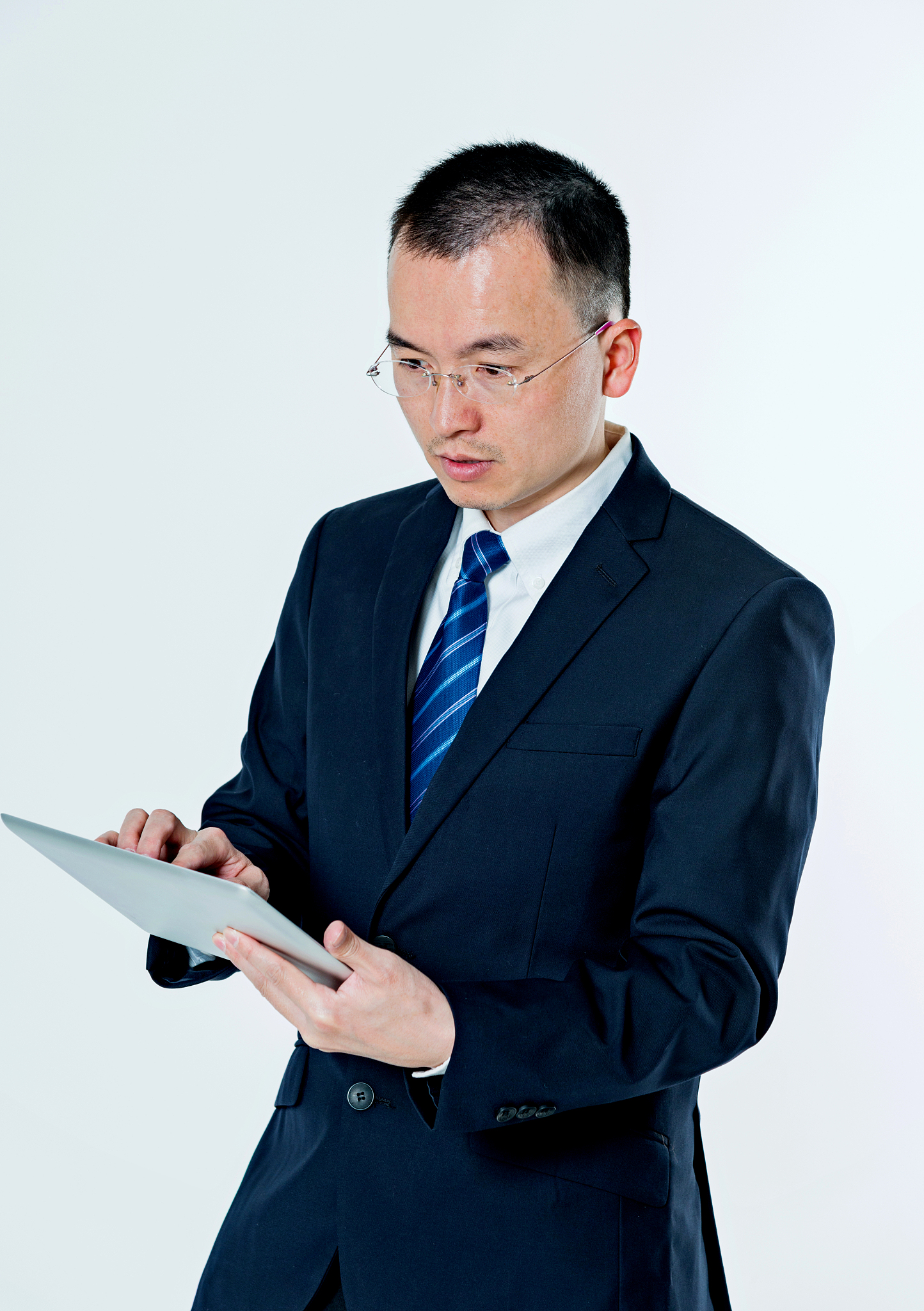 asian businessman holding a tablet computer