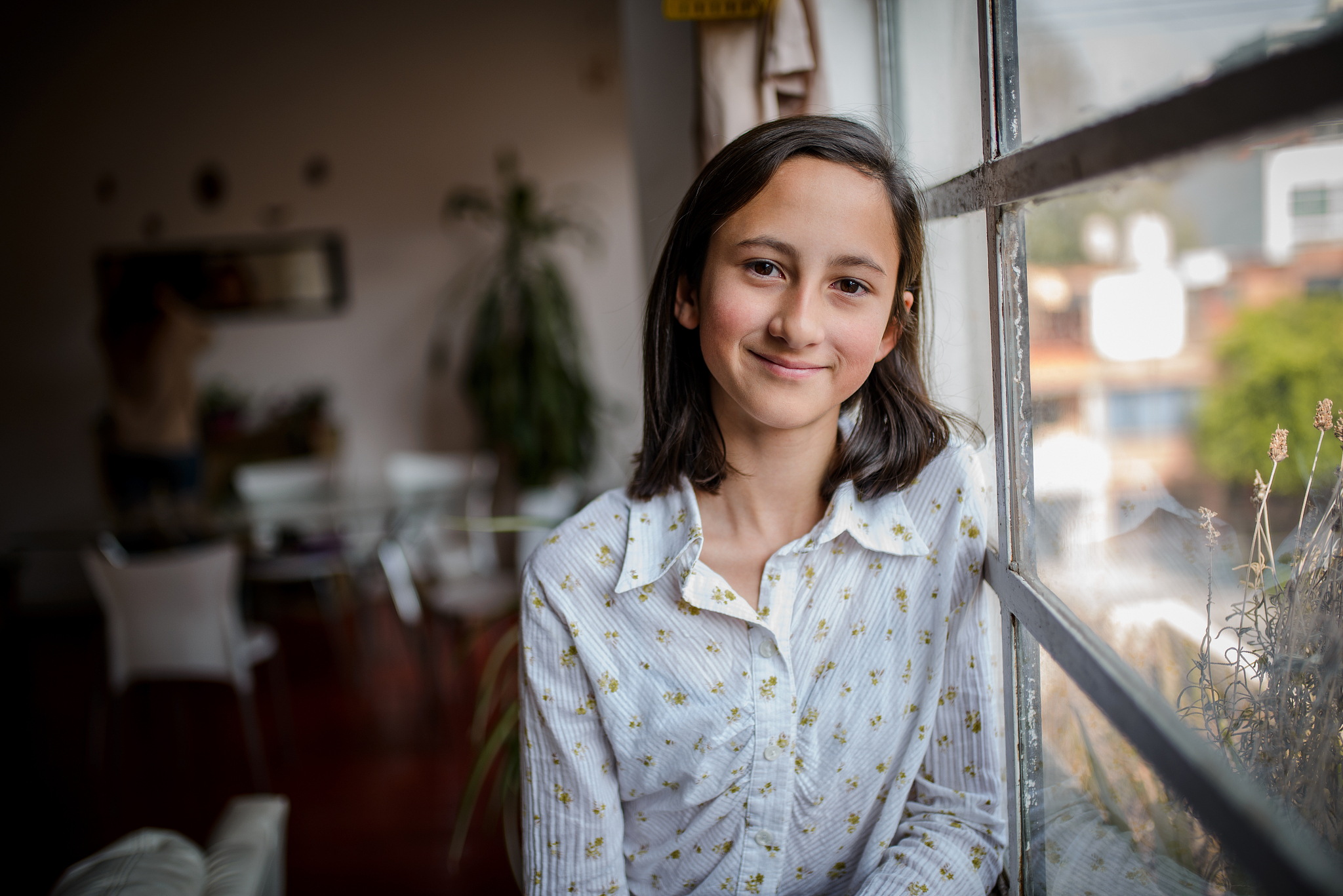 portrait of pre-adolescent girl looking at camera.