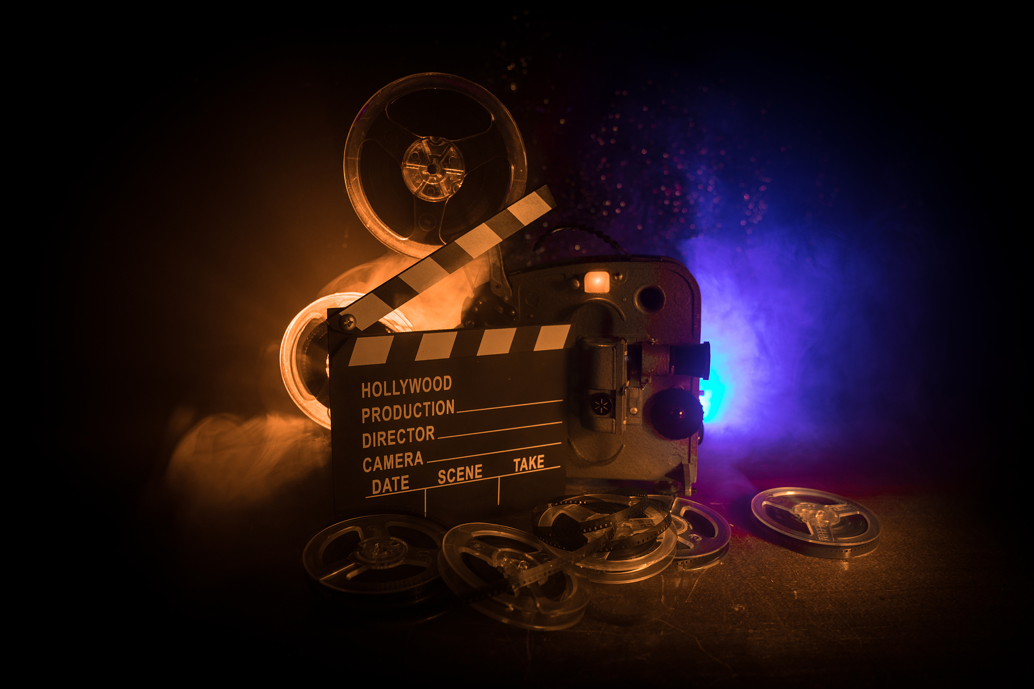 old vintage movie projector on a dark background with fog and li