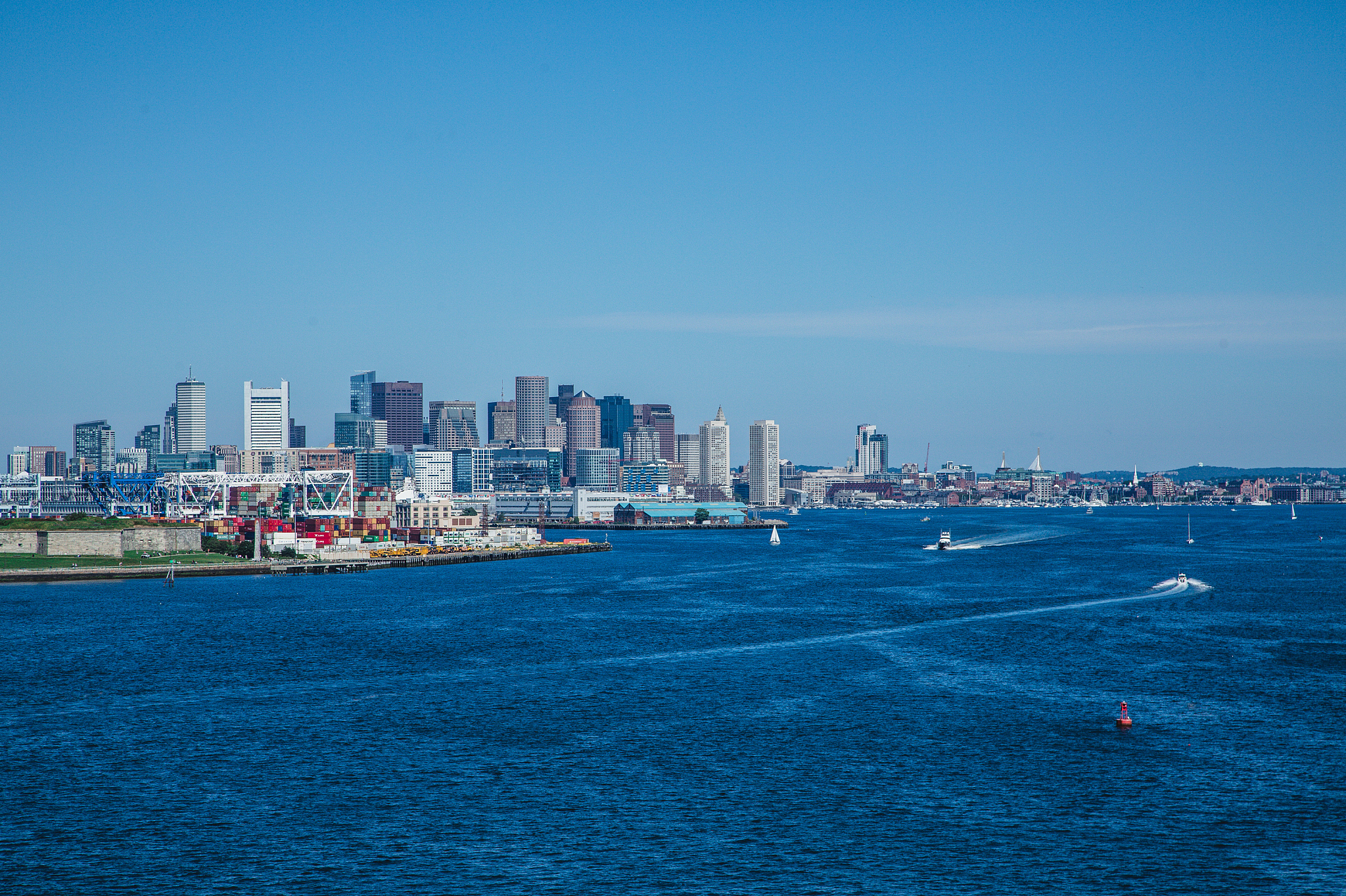 view of boston from harbor under clear blue sky