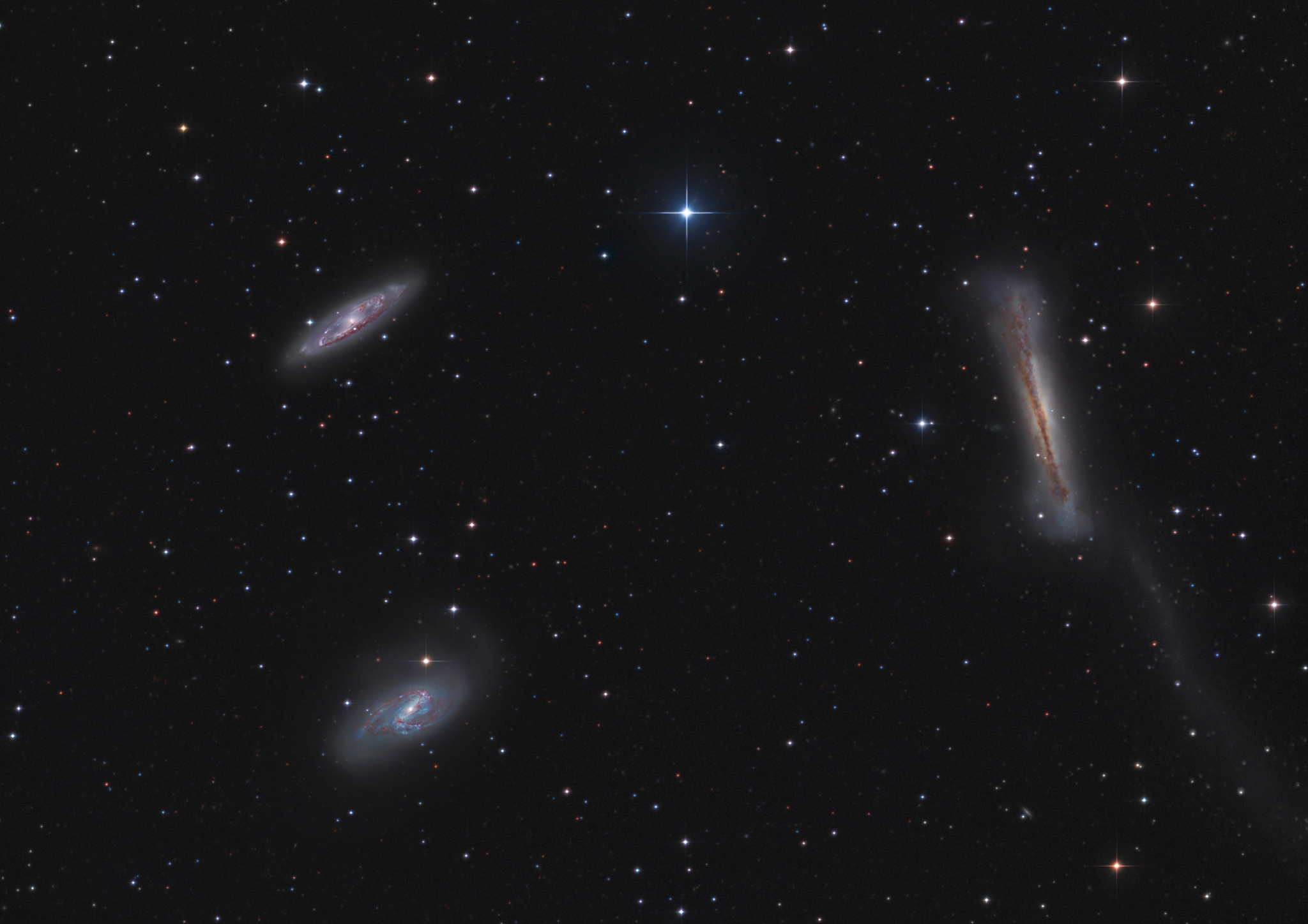 the leo triplet, a group of three galaxies in the constellation 