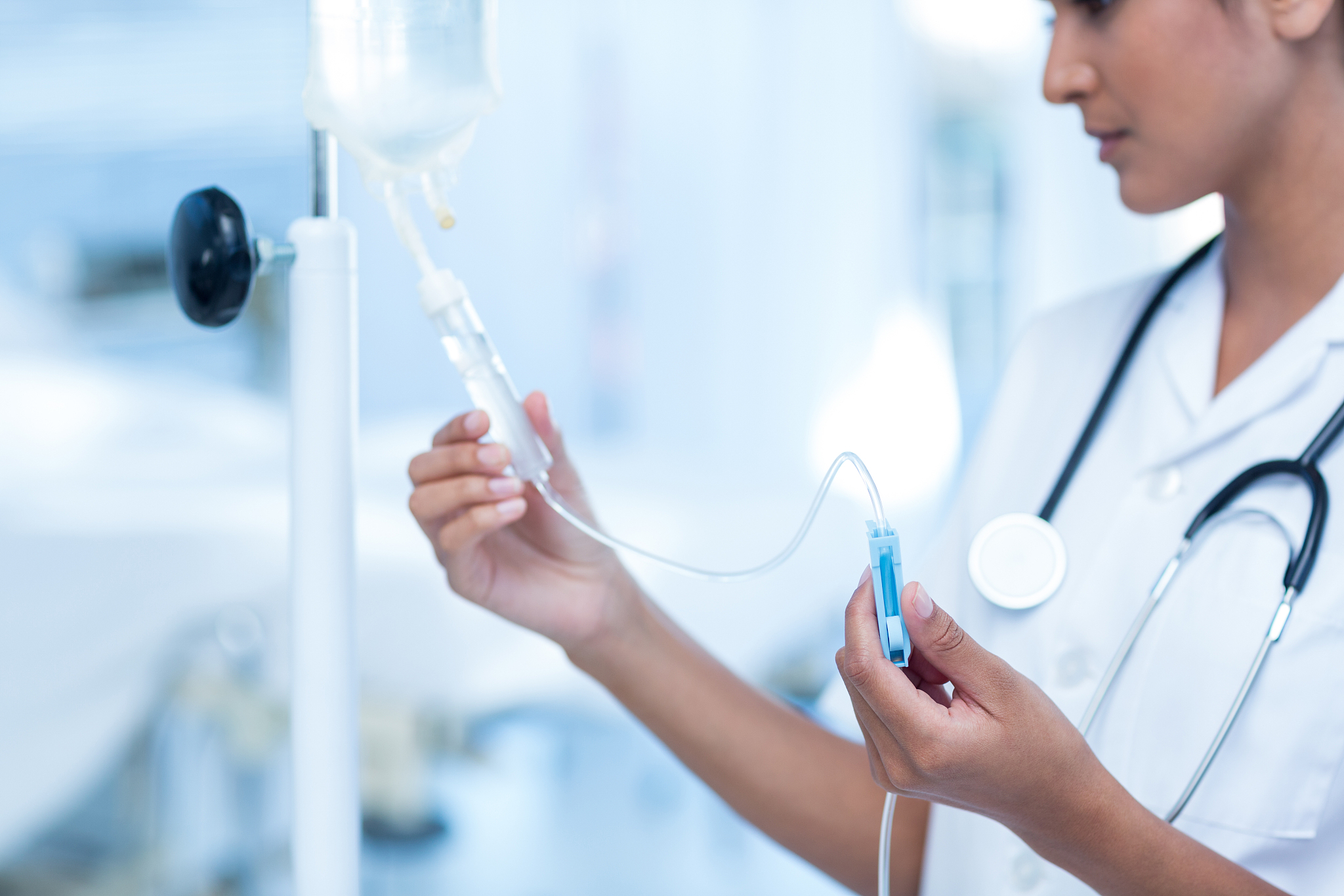 nurse connecting an intravenous