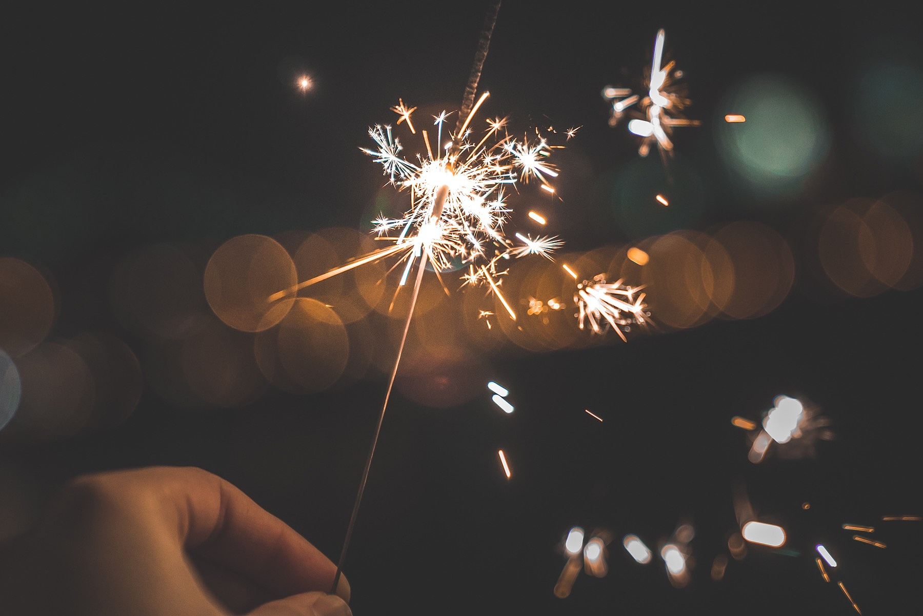 person holding sparkler
