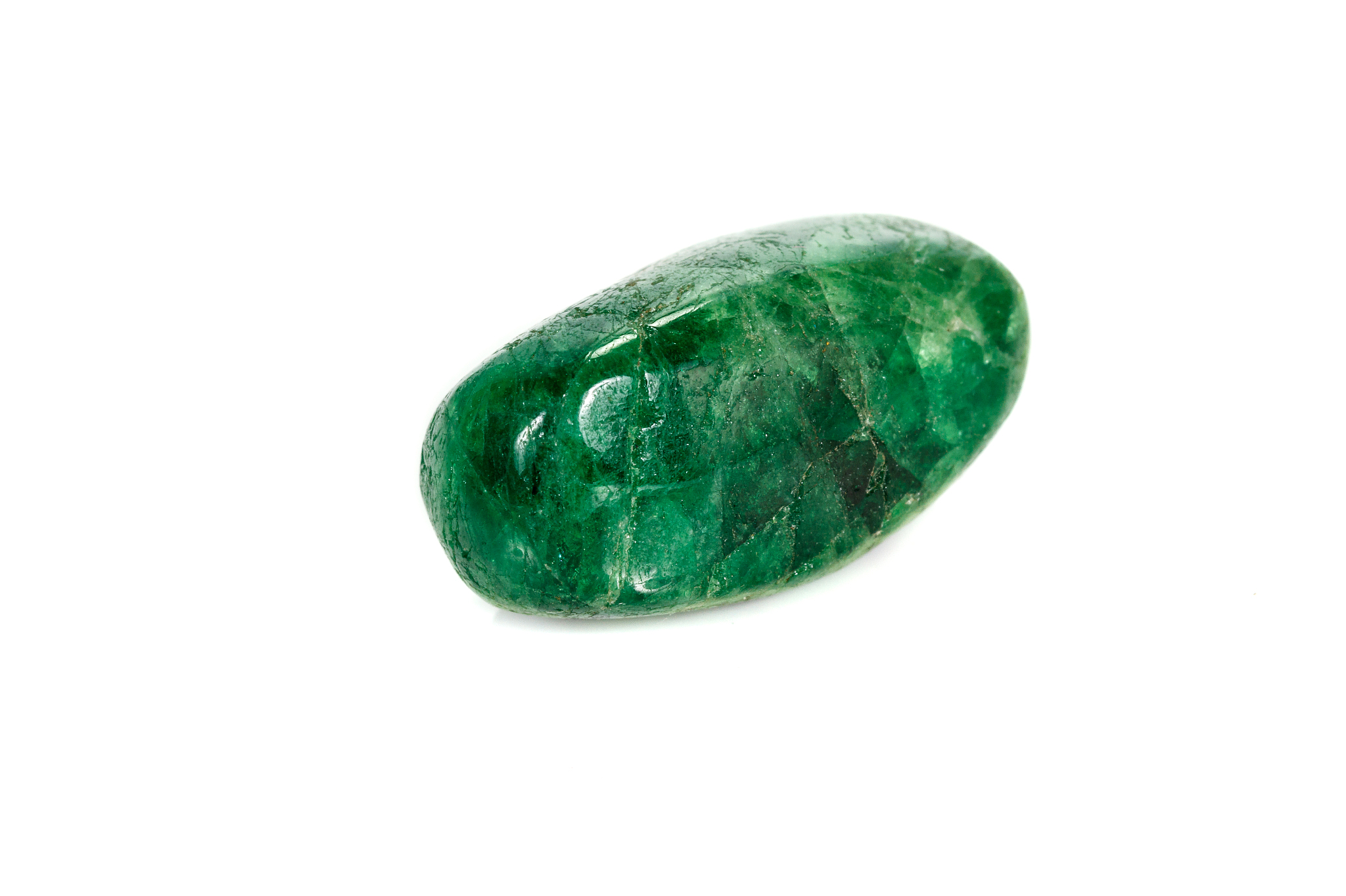 macro stone garnet mineral, uvarovite in rock on a white backgro