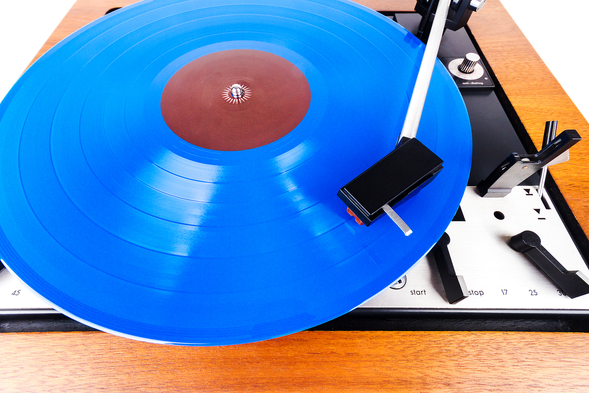 vintage turntable with a blue vinyl isolated on white