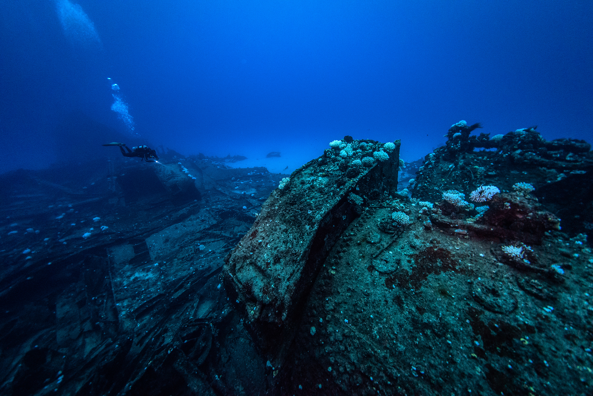 man swimming undersea